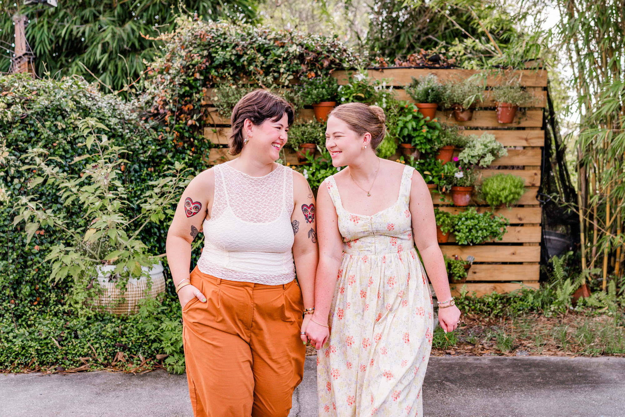 Same sex couple holding hands and walking