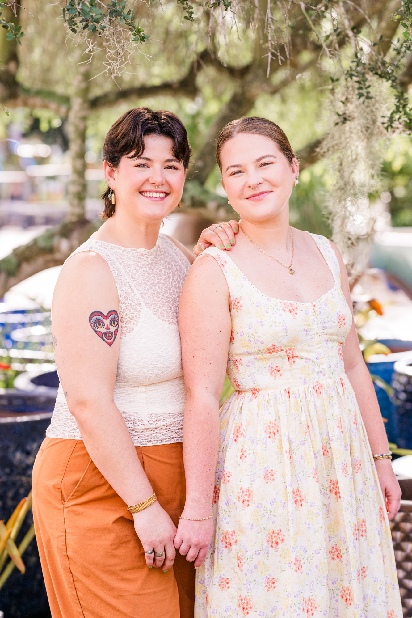 Two women smiling during their engagement session at Rockledge Gardens