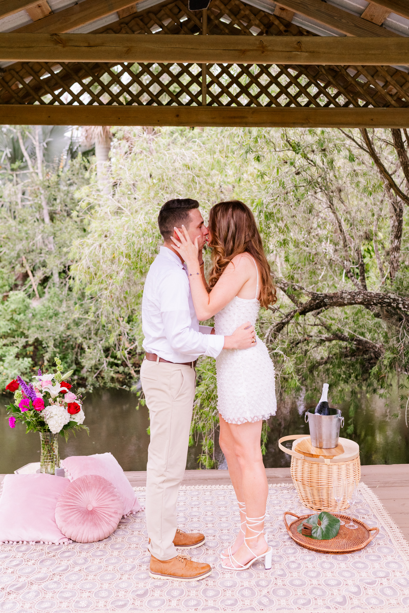 couple kissing after getting engaged