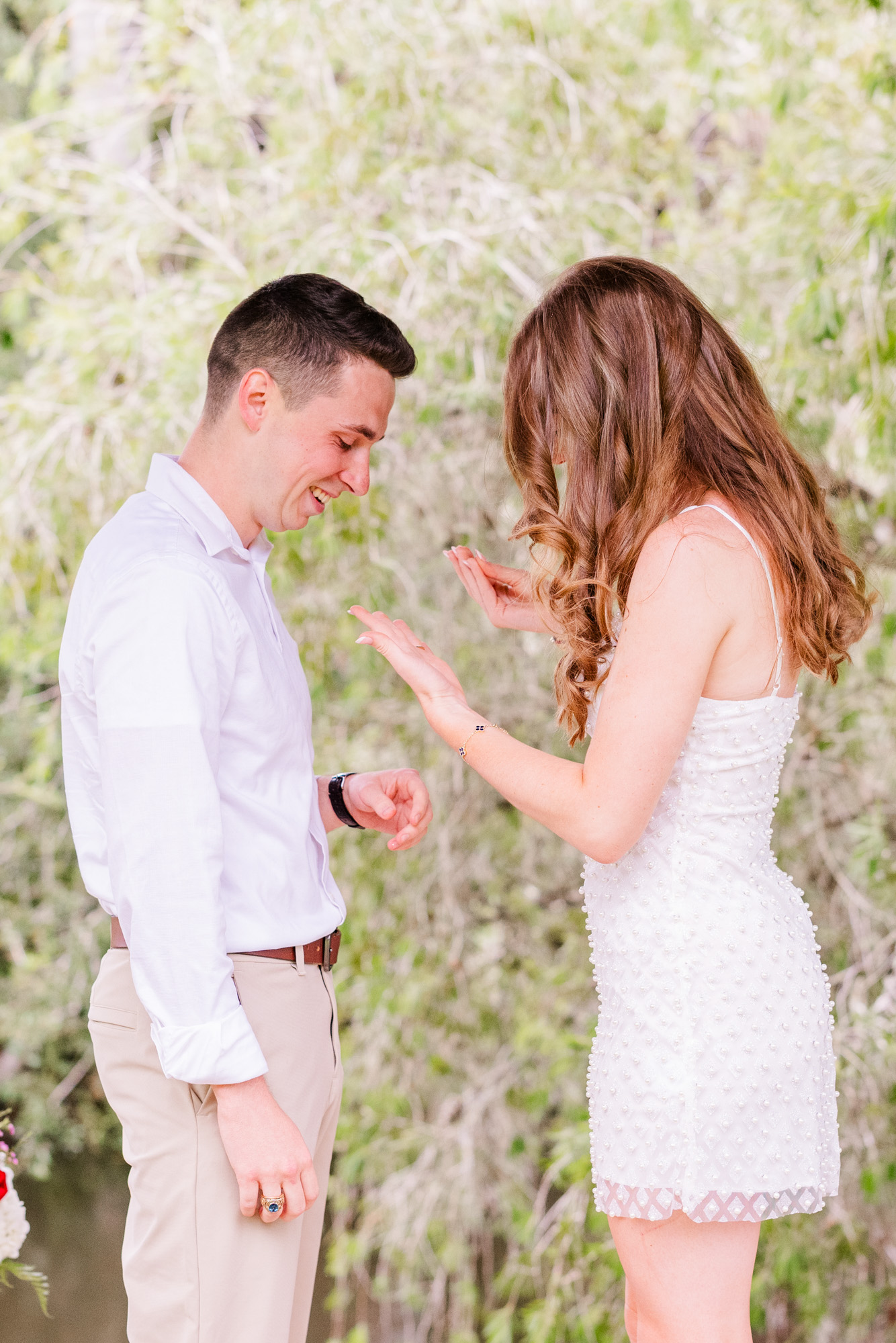 woman looking at engagement ring after she got proposed to
