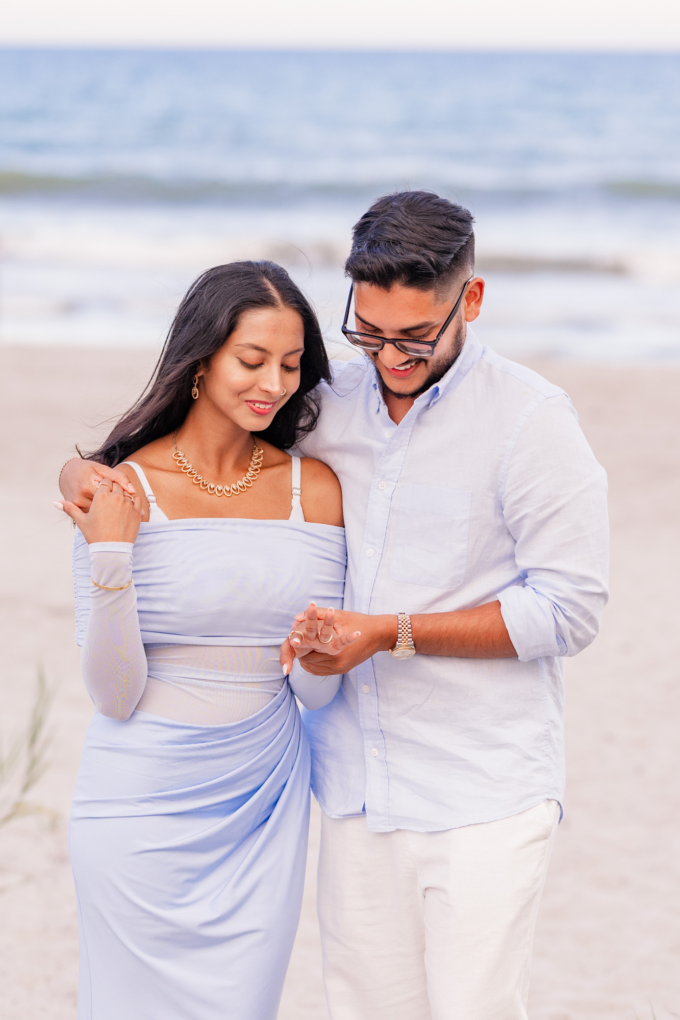 Couple looking at the engagement ring