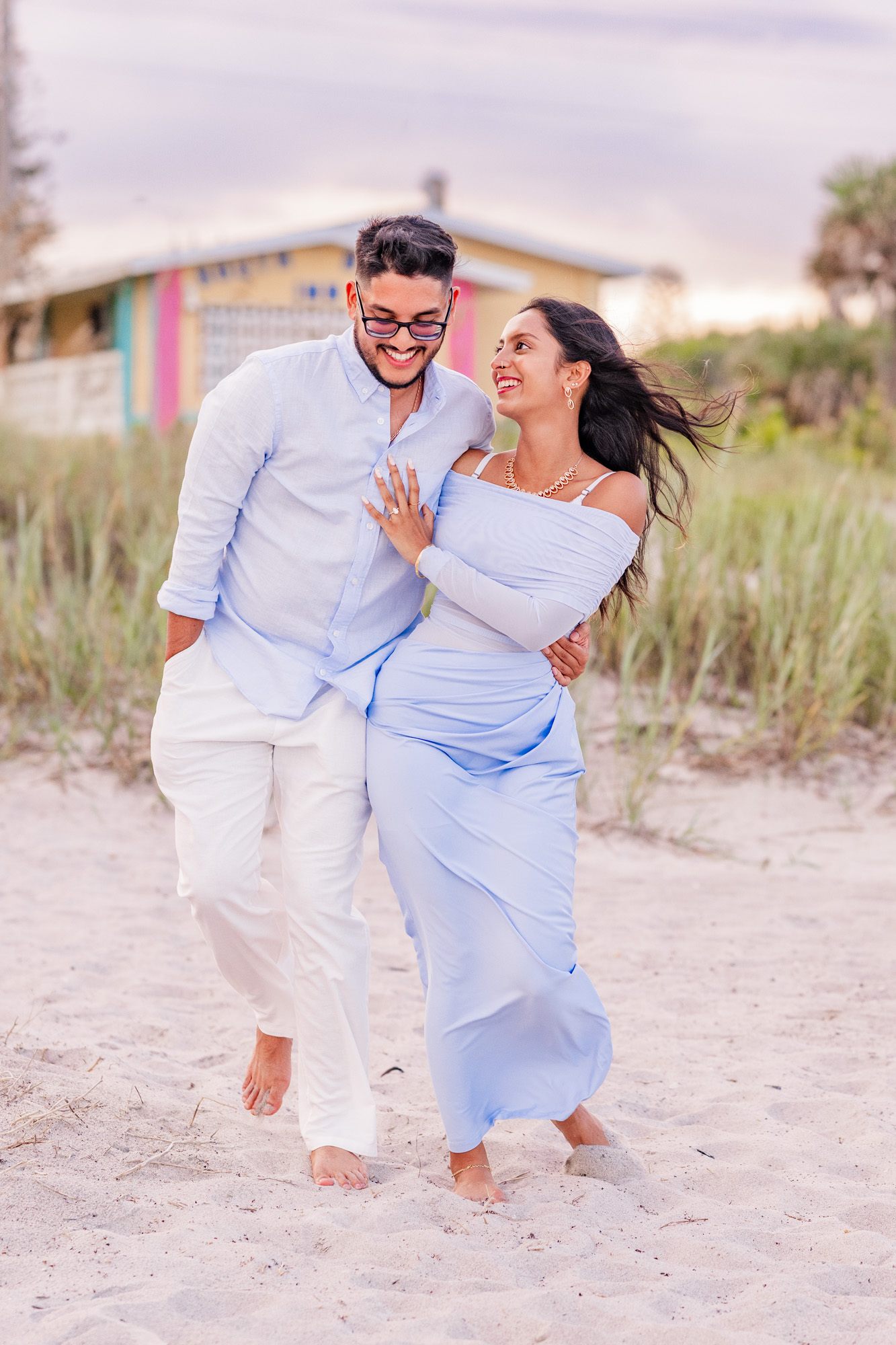 couple walking and laughing on Cocoa Beach