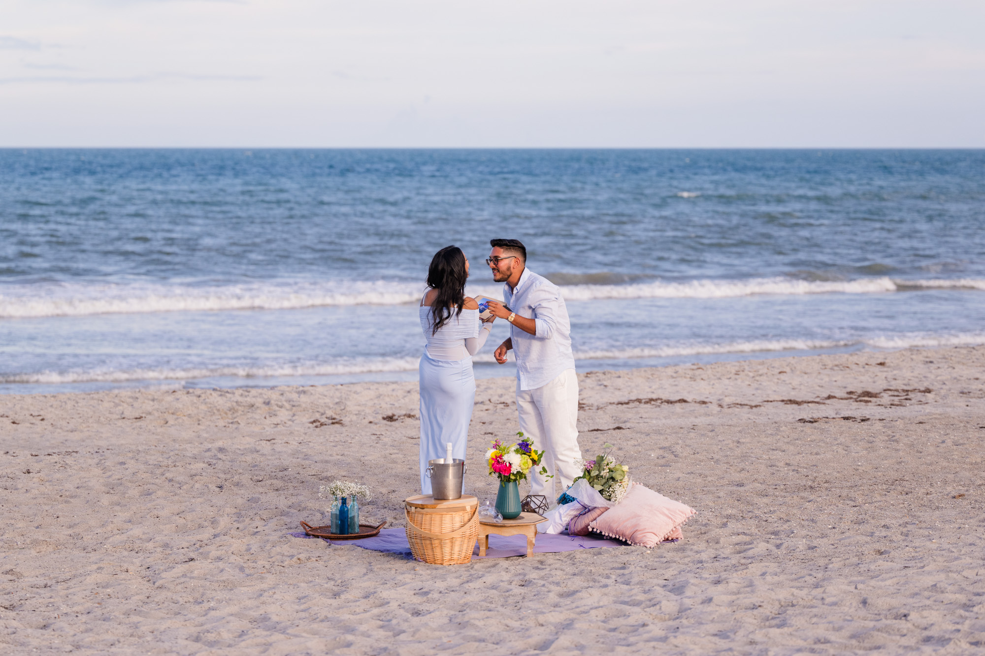 Man about to kiss woman on Cocoa Beach after his marriage proposal