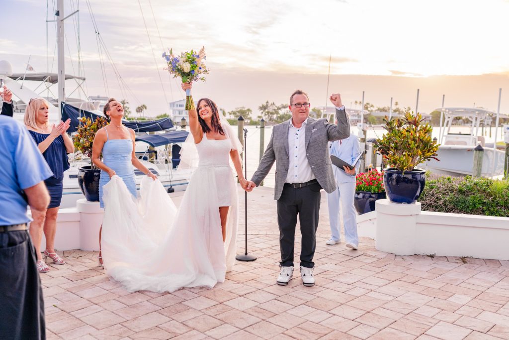 Couple celebrating after elopement at the Eau Gallie Yacht Club Melbourne Florida