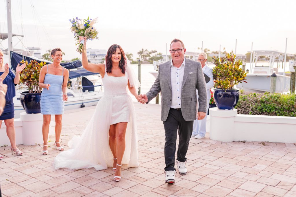 Couple celebrating after saying I do at the Eau Gallie Yacht Club