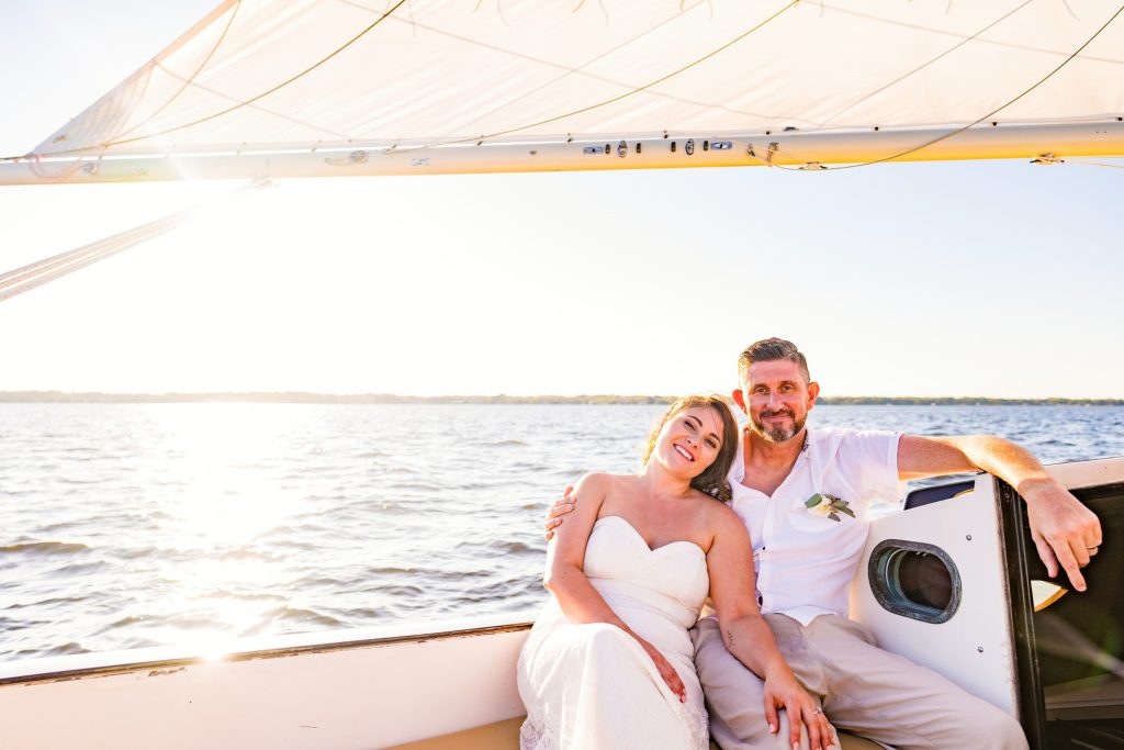 Couple eloping on a sailboat in the Indian River Lagoon