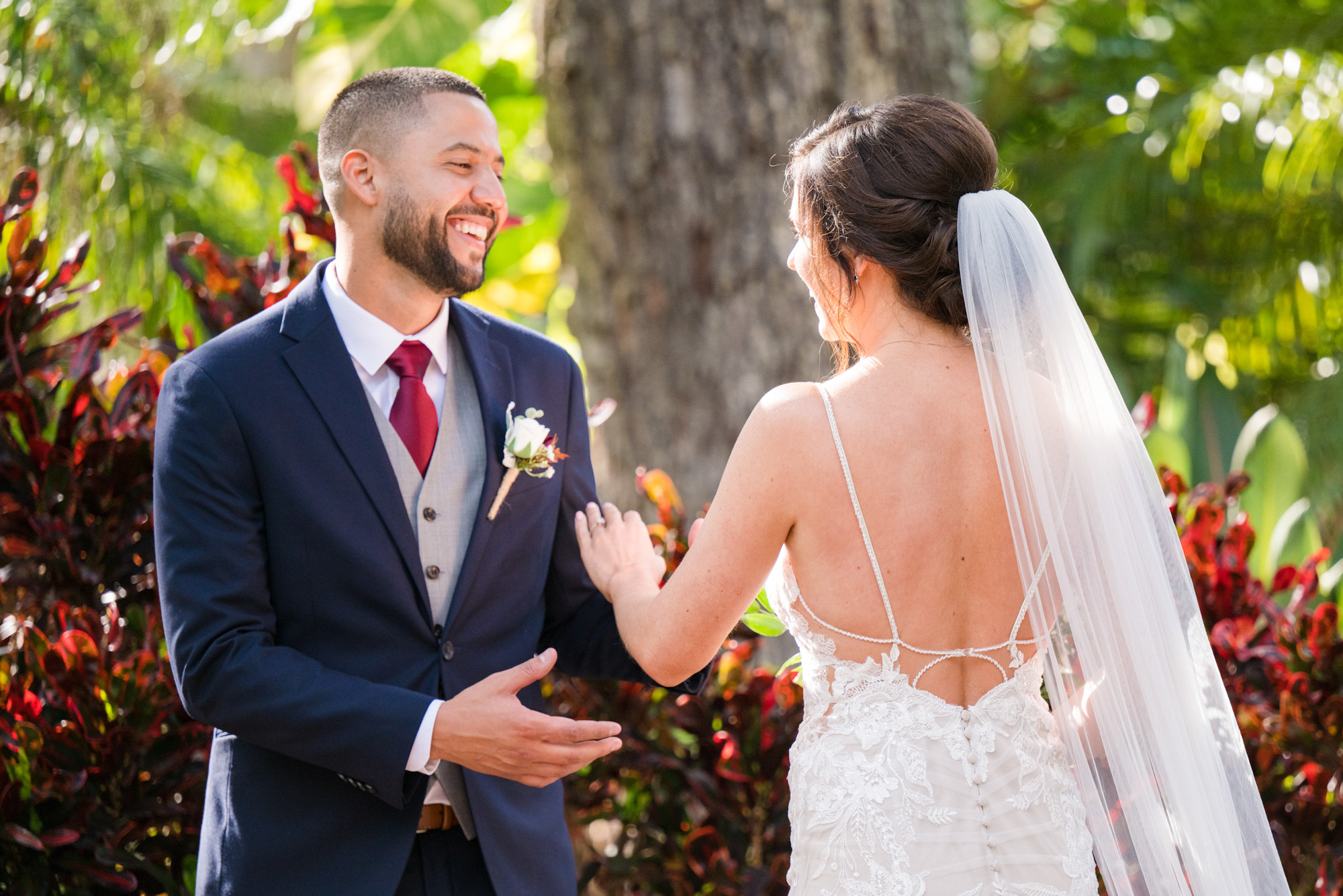 Groom smiling at the bride during their first look at Estate on the Halifax.