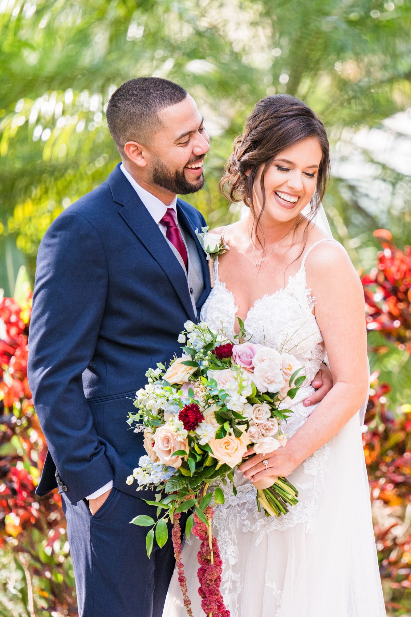 Bride smiling with her bouquet during an outdoor bridal portrait at Estate on the Halifax.
