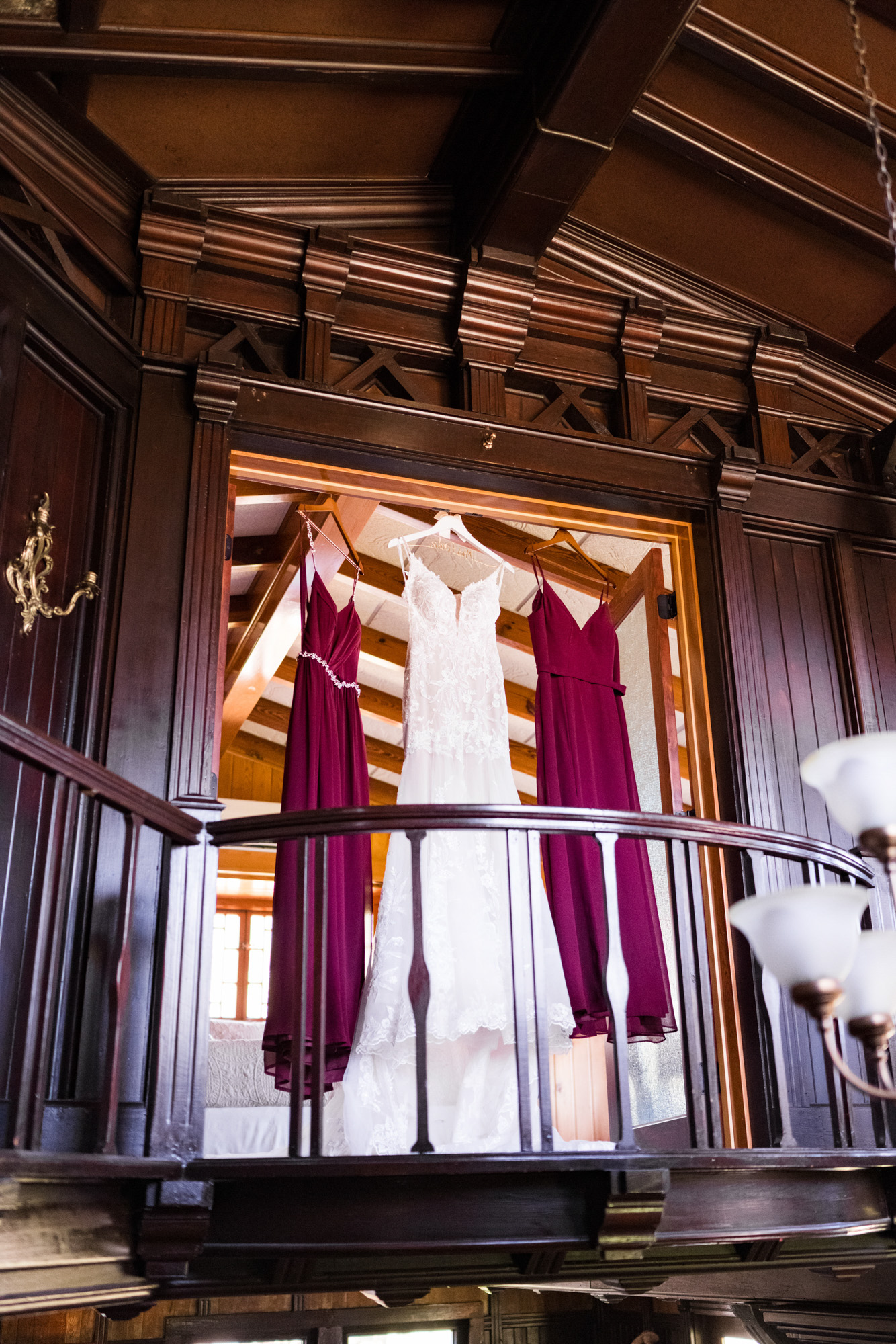 Wedding dress and bridesmaid dresses hanging inside the historic Estate on the Halifax in Port Orange, Florida.