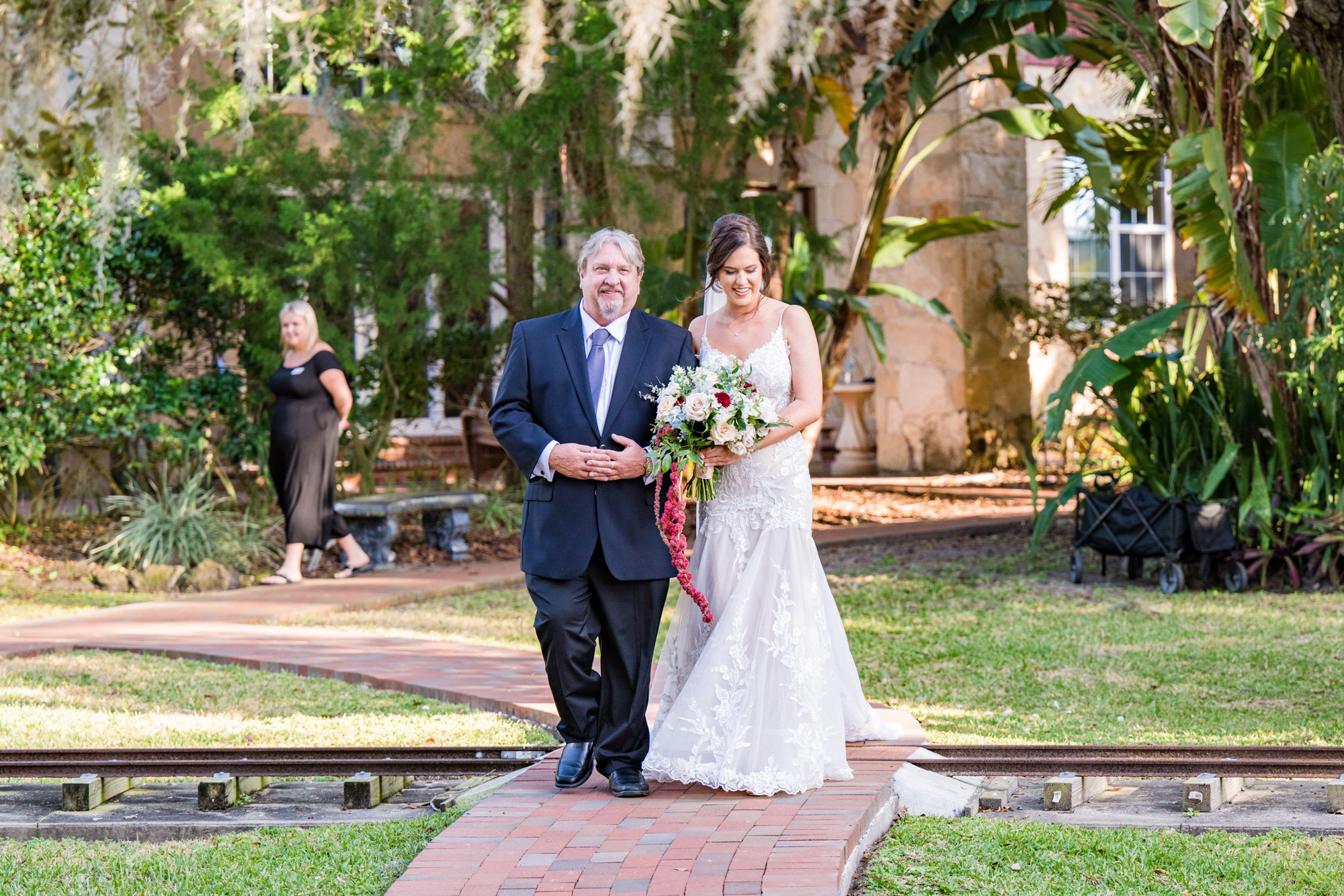 Bride walking down the aisle with her father during an outdoor Estate on the Halifax wedding ceremony.