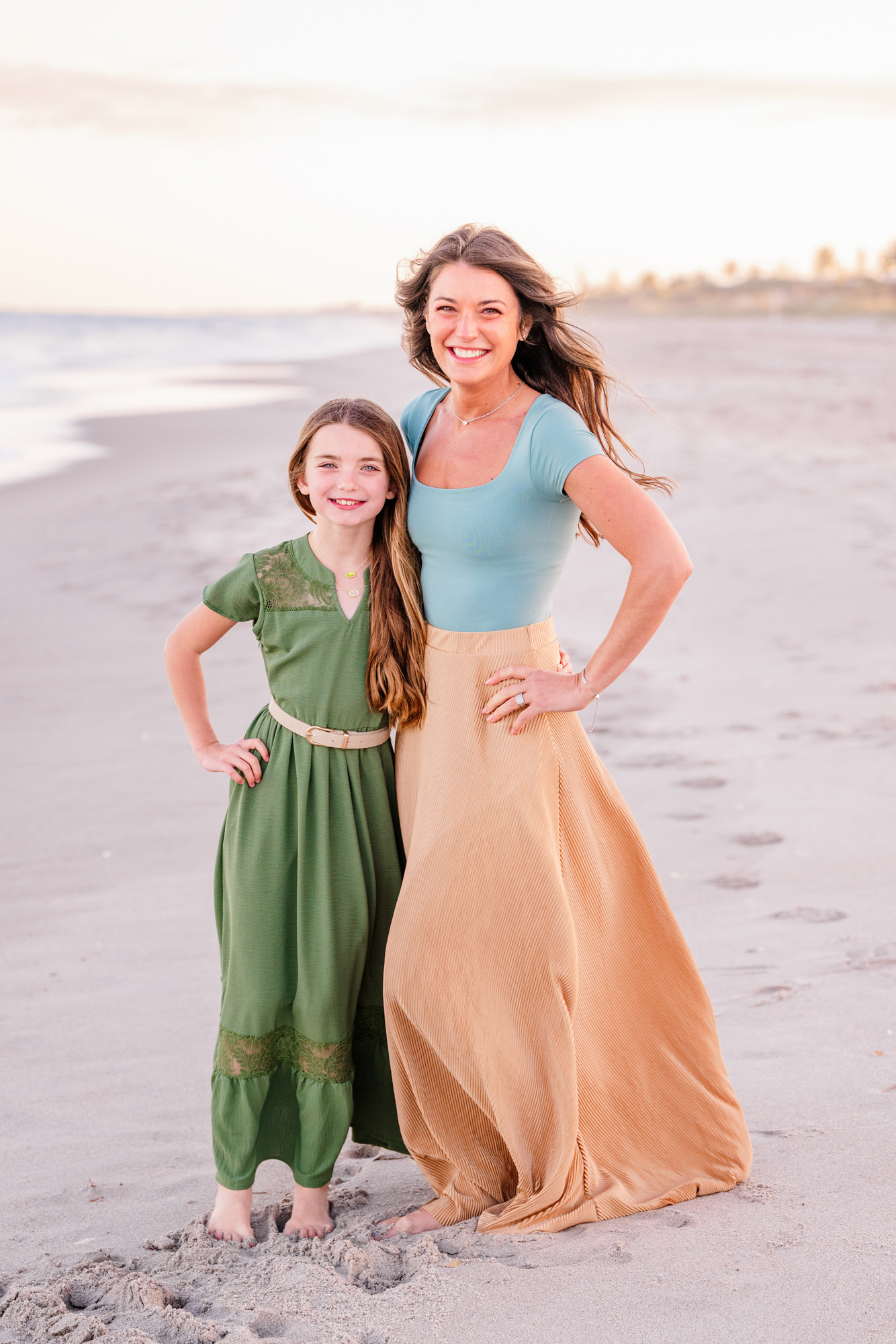 Mom and daughter dressed in greens and yellows for their Melbourne Beach family session