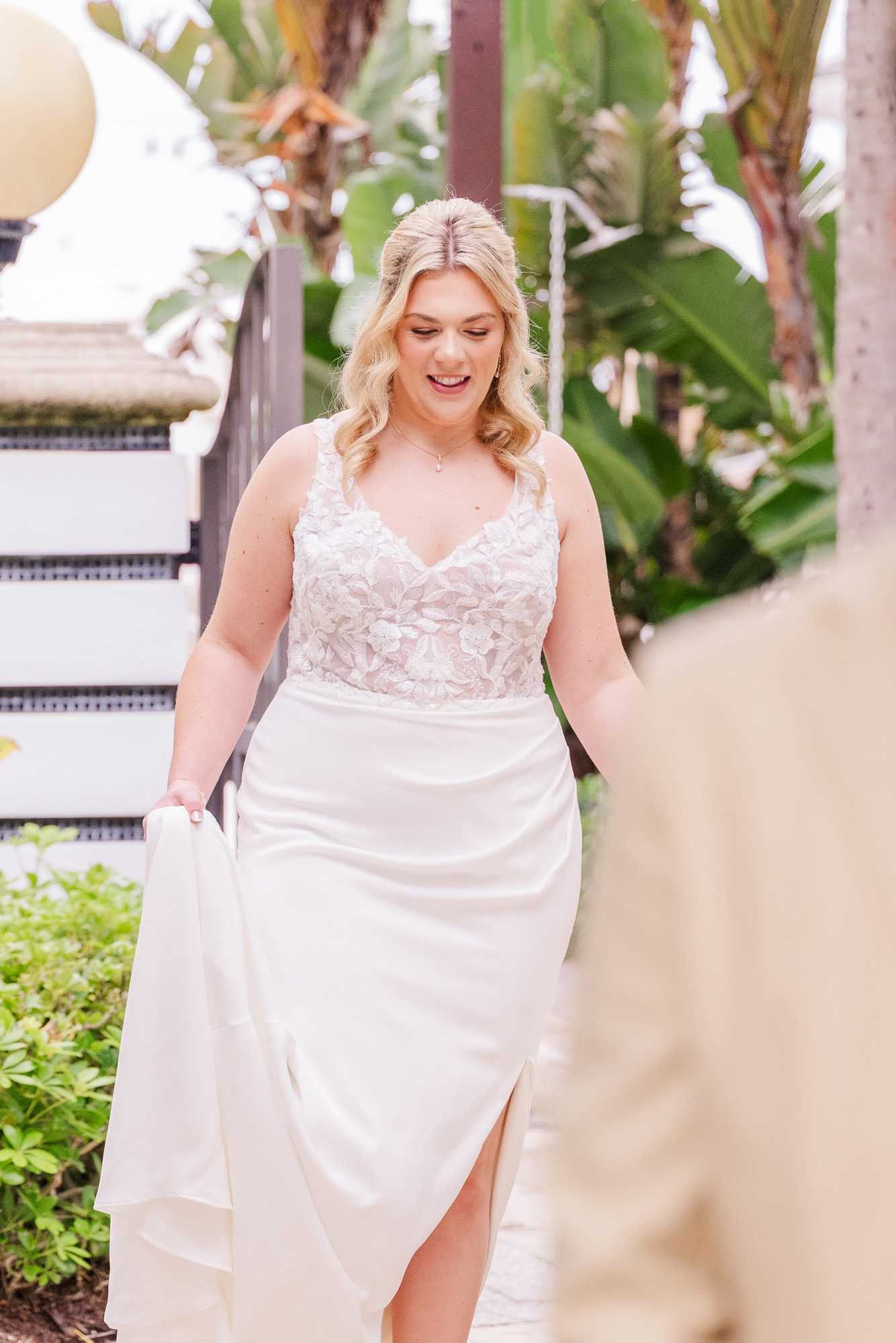 Bride smiles as she approaches the groom for their first look.