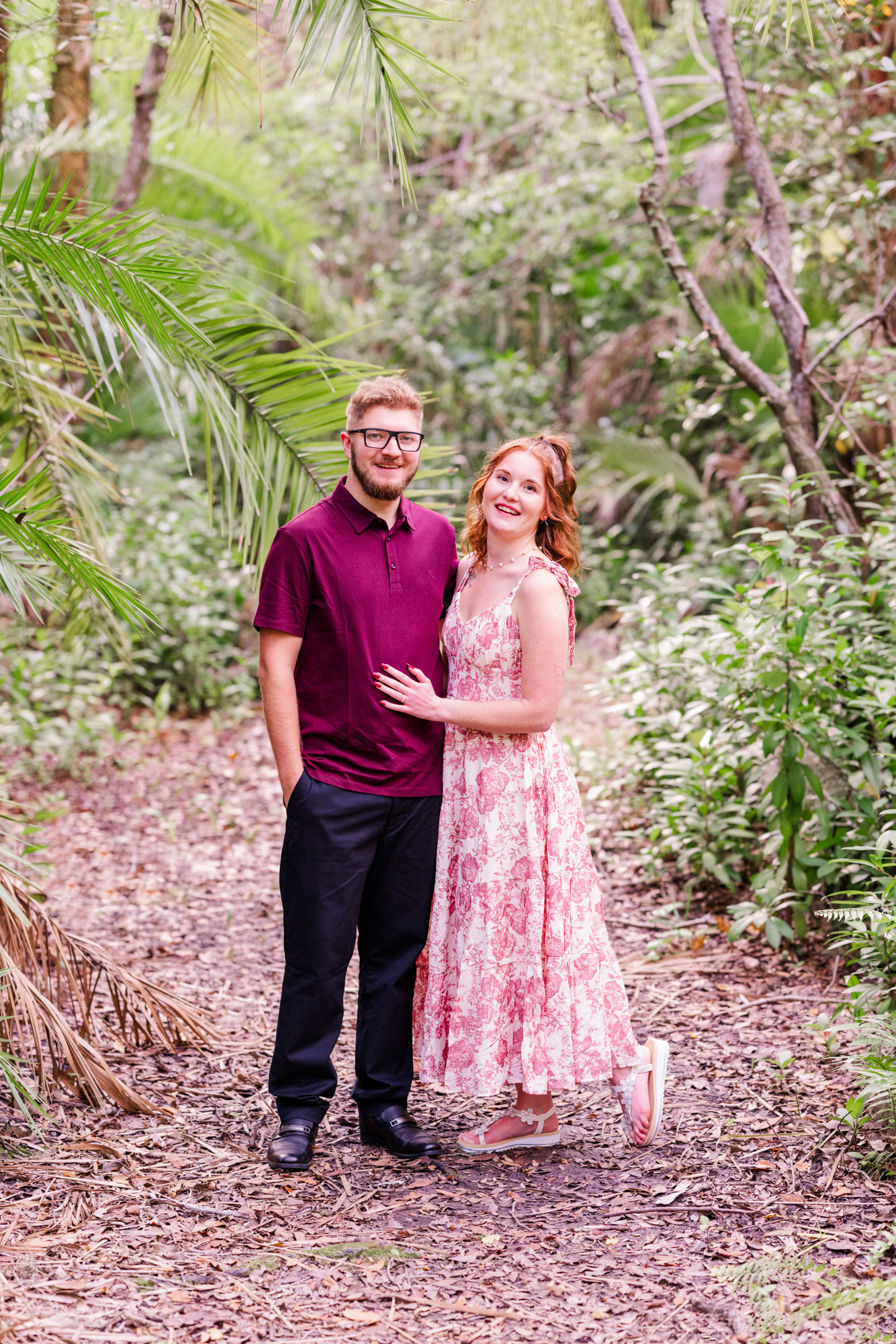 Couple with arms around each other in the Florida Tech Botanical Gardens