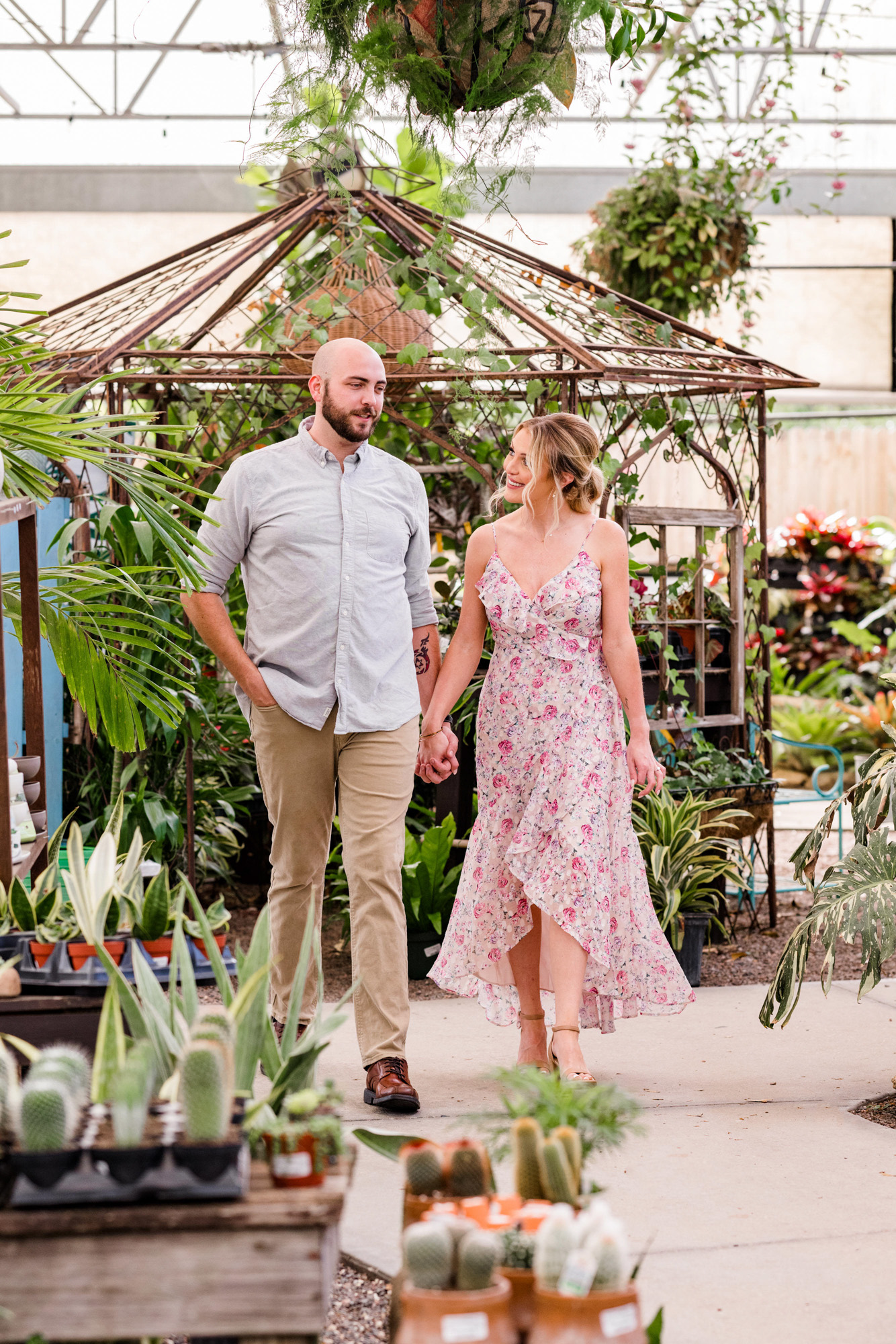 Man and woman holding hands during their Rockledge Gardens engagement session
