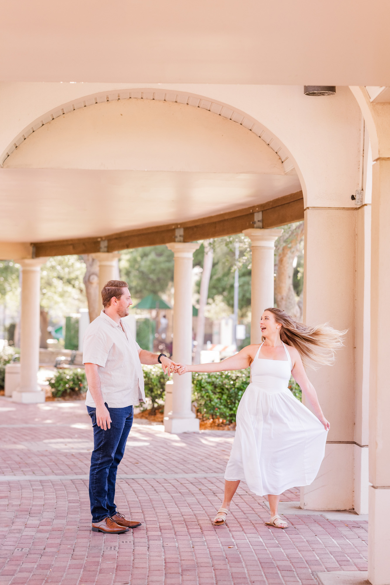 Couple twirling during their Cocoa Village engagement session