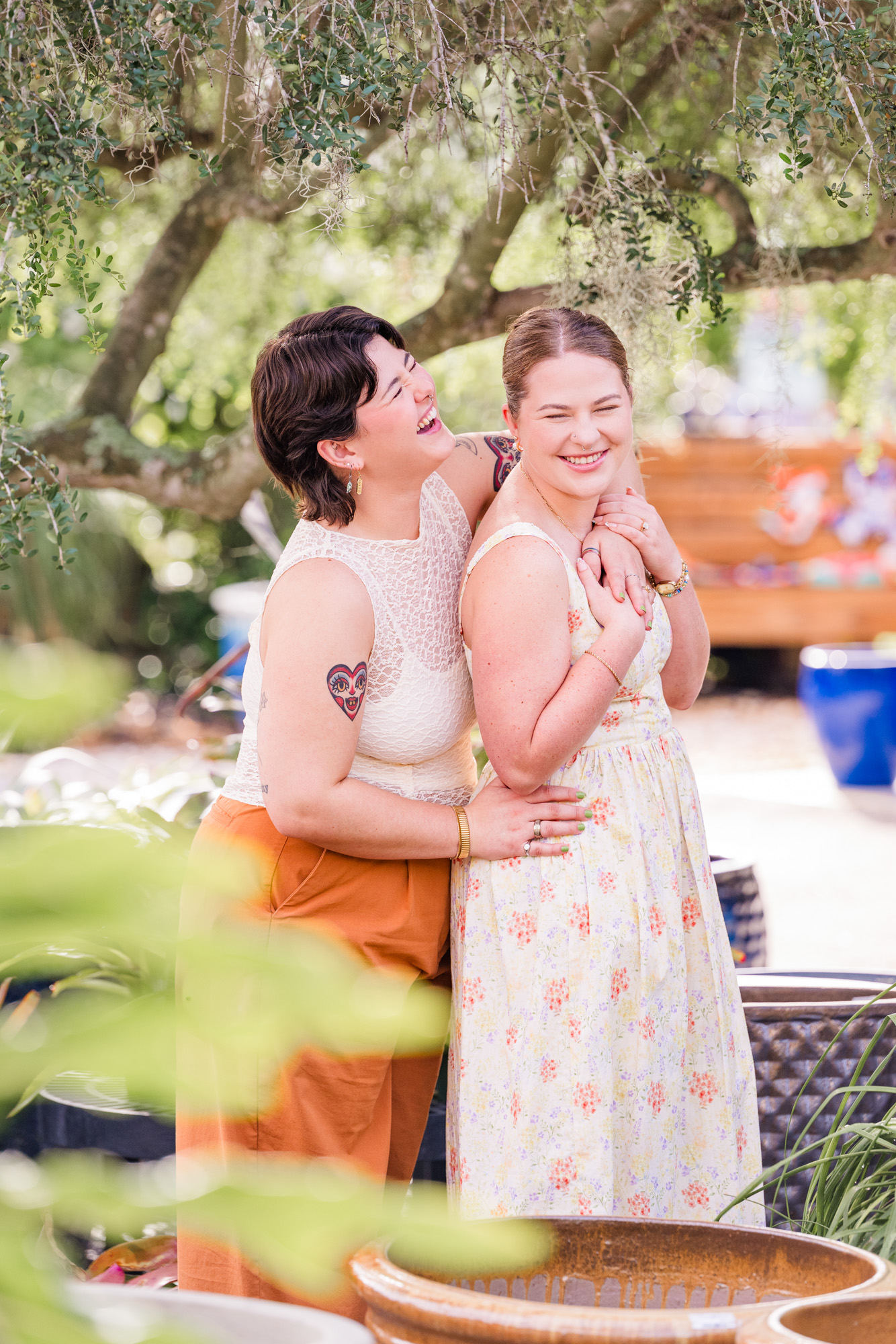 Two women laughing during their engagement session at Rockledge Gardens