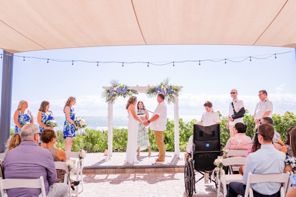 couple eloping at the Melbourne Beach Hilton Oceanfront in the morning