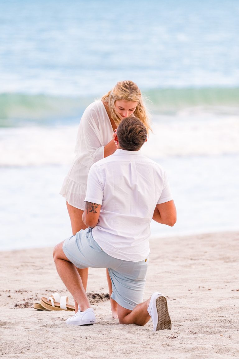 couple on beach during a proposal session