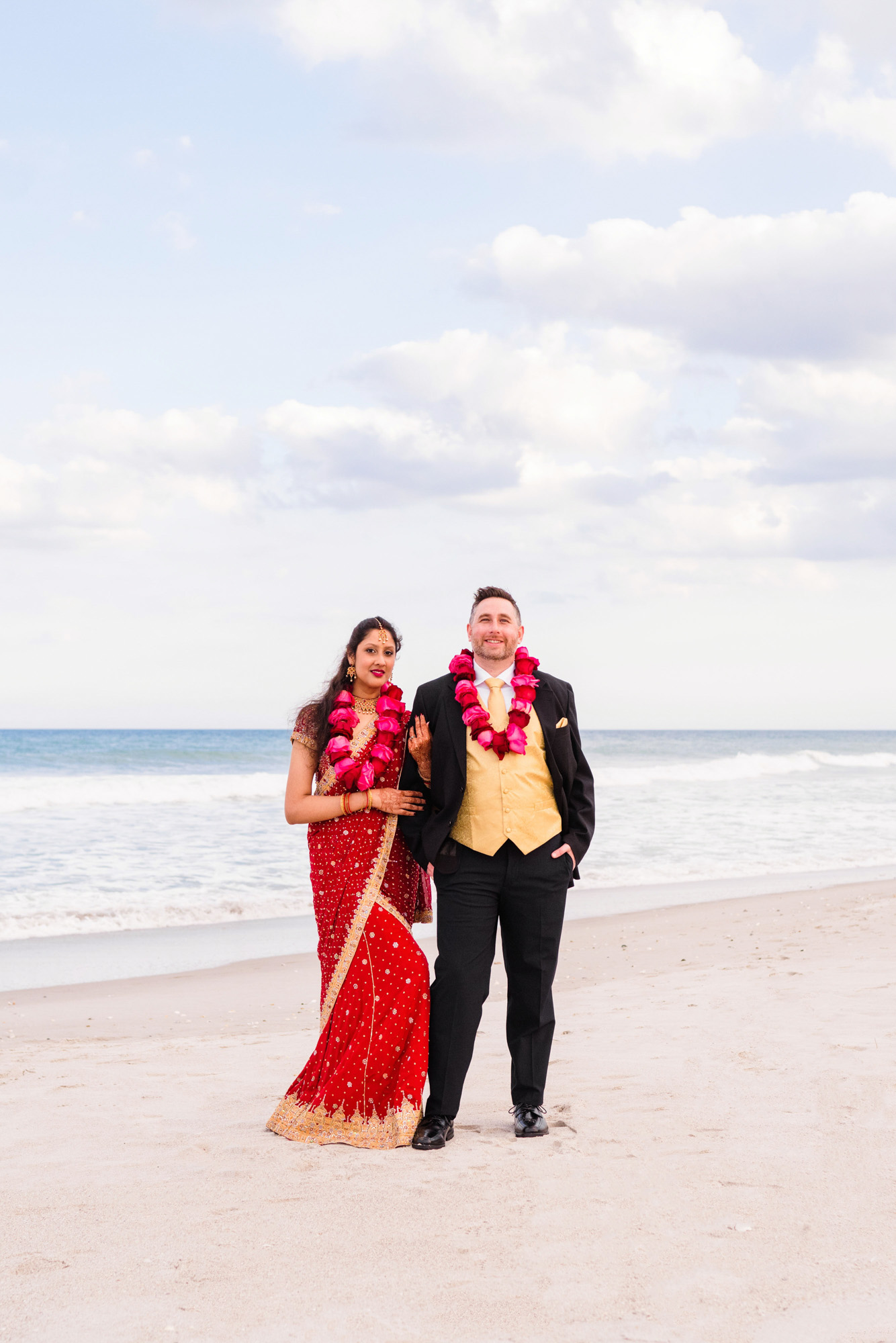 Couple celebrating their wedding on the beach