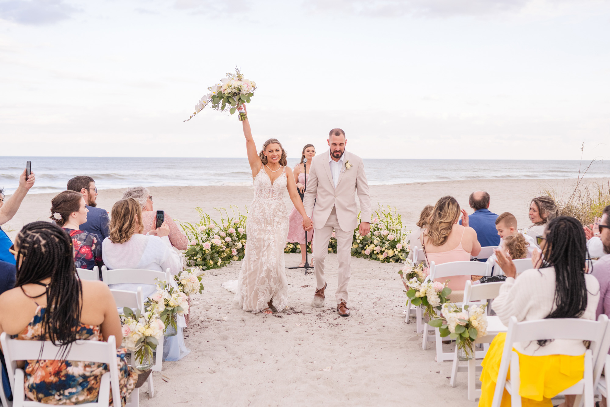 Couple celebrating after getting married at the Melbourne Beach Hilton