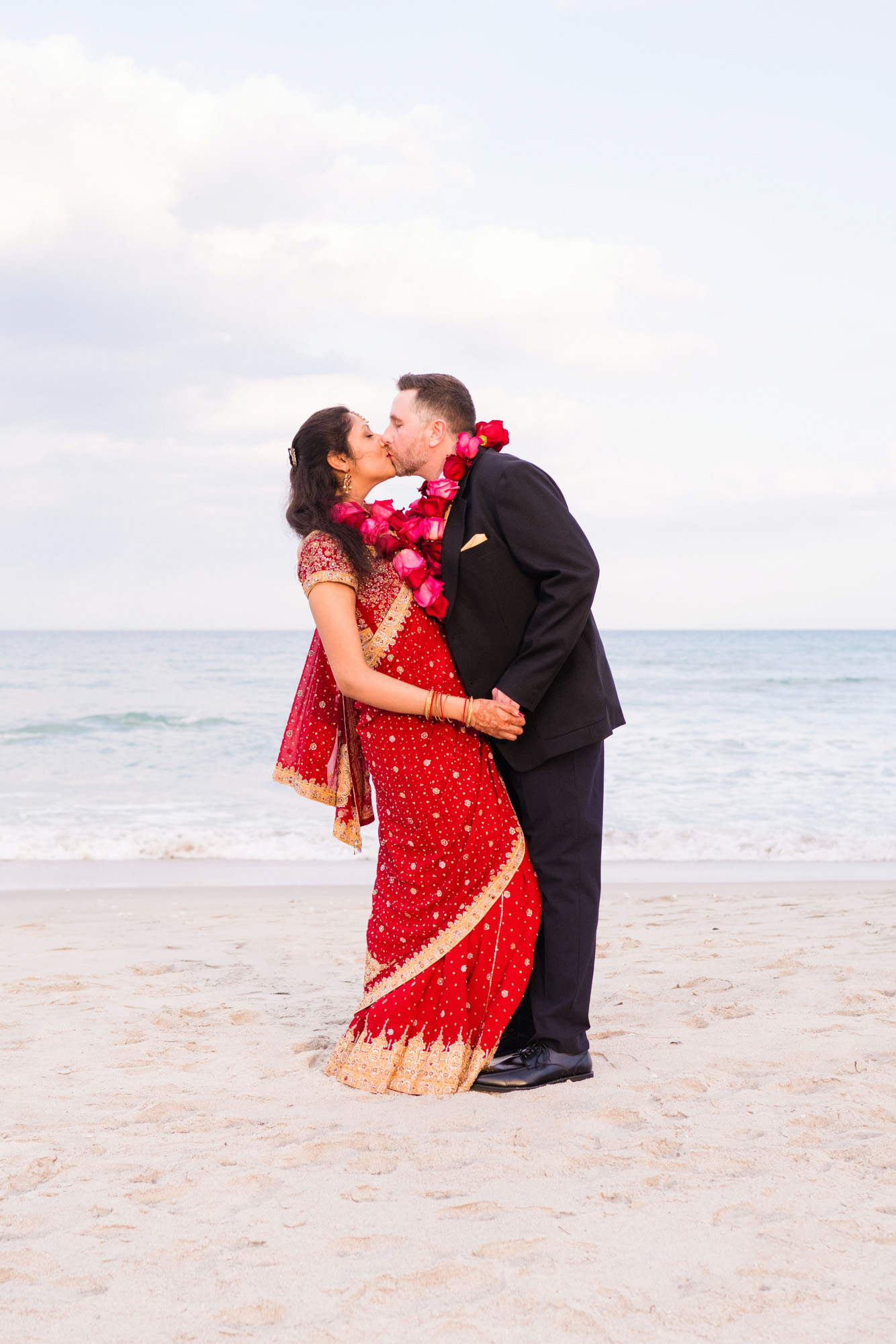 Couple kissing on the beach