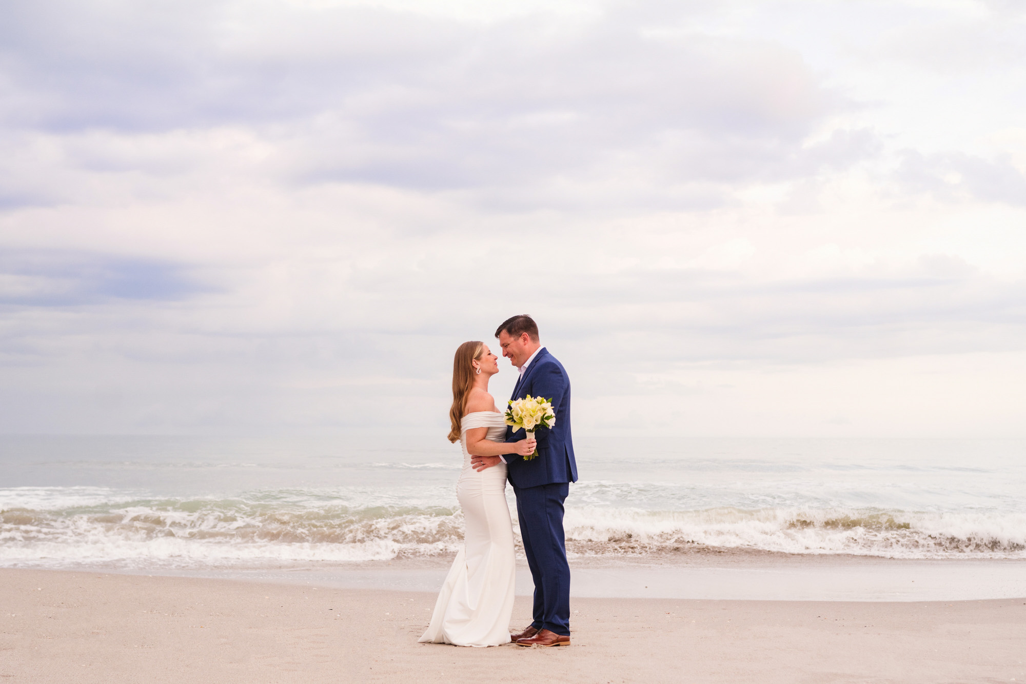 couple on the beach after their Melbourne Beach wedding
