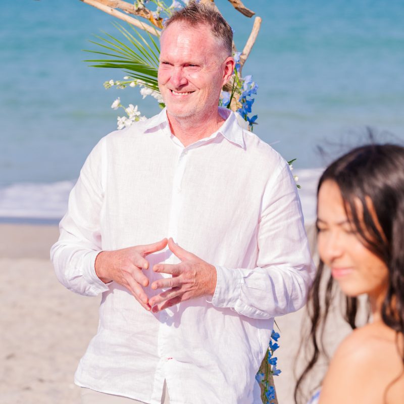 Groom seeing his bride for the first time walking down the aisle