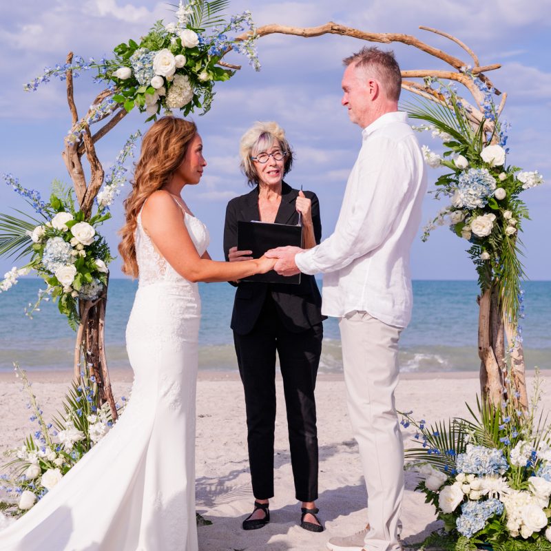 Couple saying vows with the ocean as the backdrop in Melbourne Beach