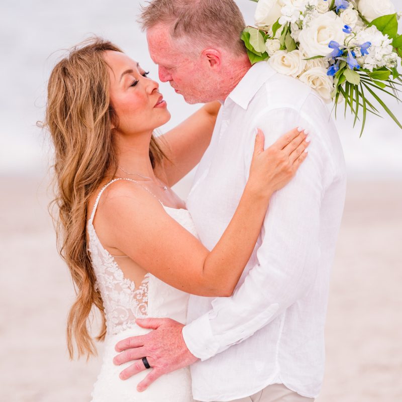 couple kissing at their Melbourne beach wedding