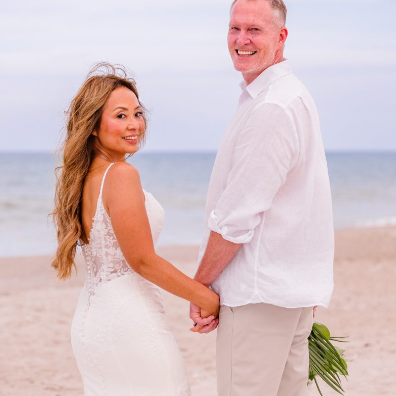Couple looking back over their shoulders