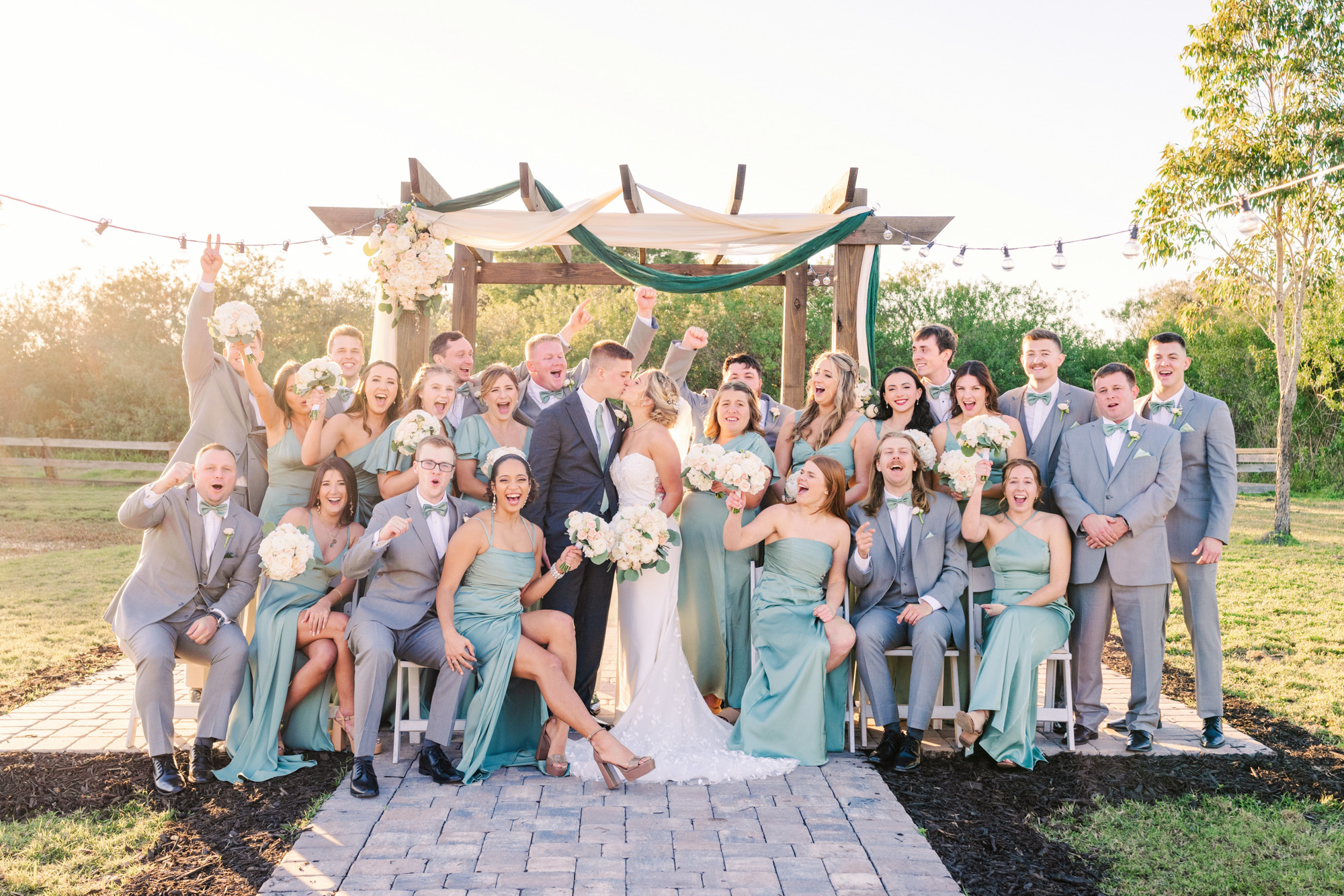 large wedding party of 22 people cheering at a Melbourne, Florida wedding