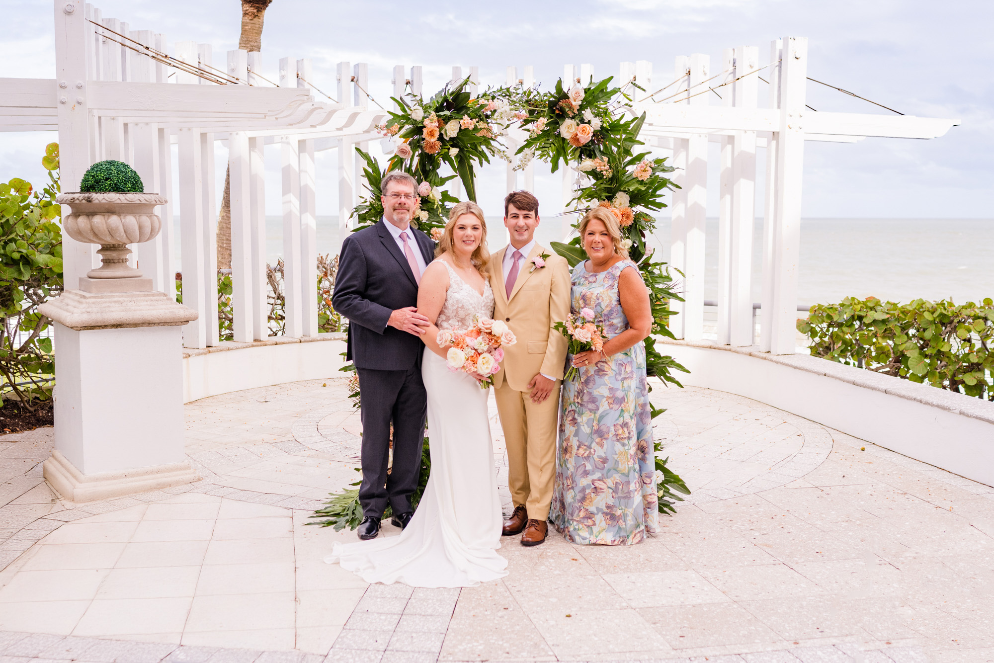 couple with their parents during family formal time at vero Beach Hotel and Spa wedding