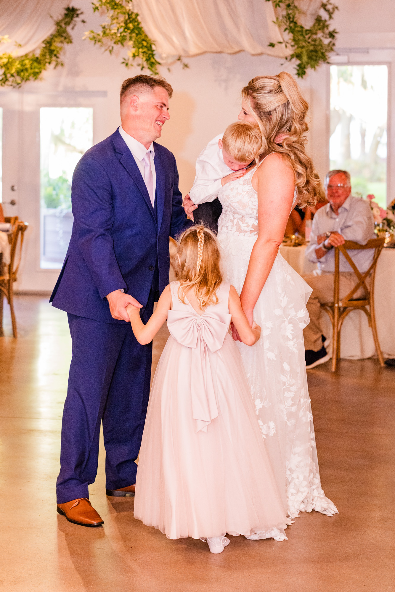 Bride and groom and kids during their first dance at Up the Creek Farms