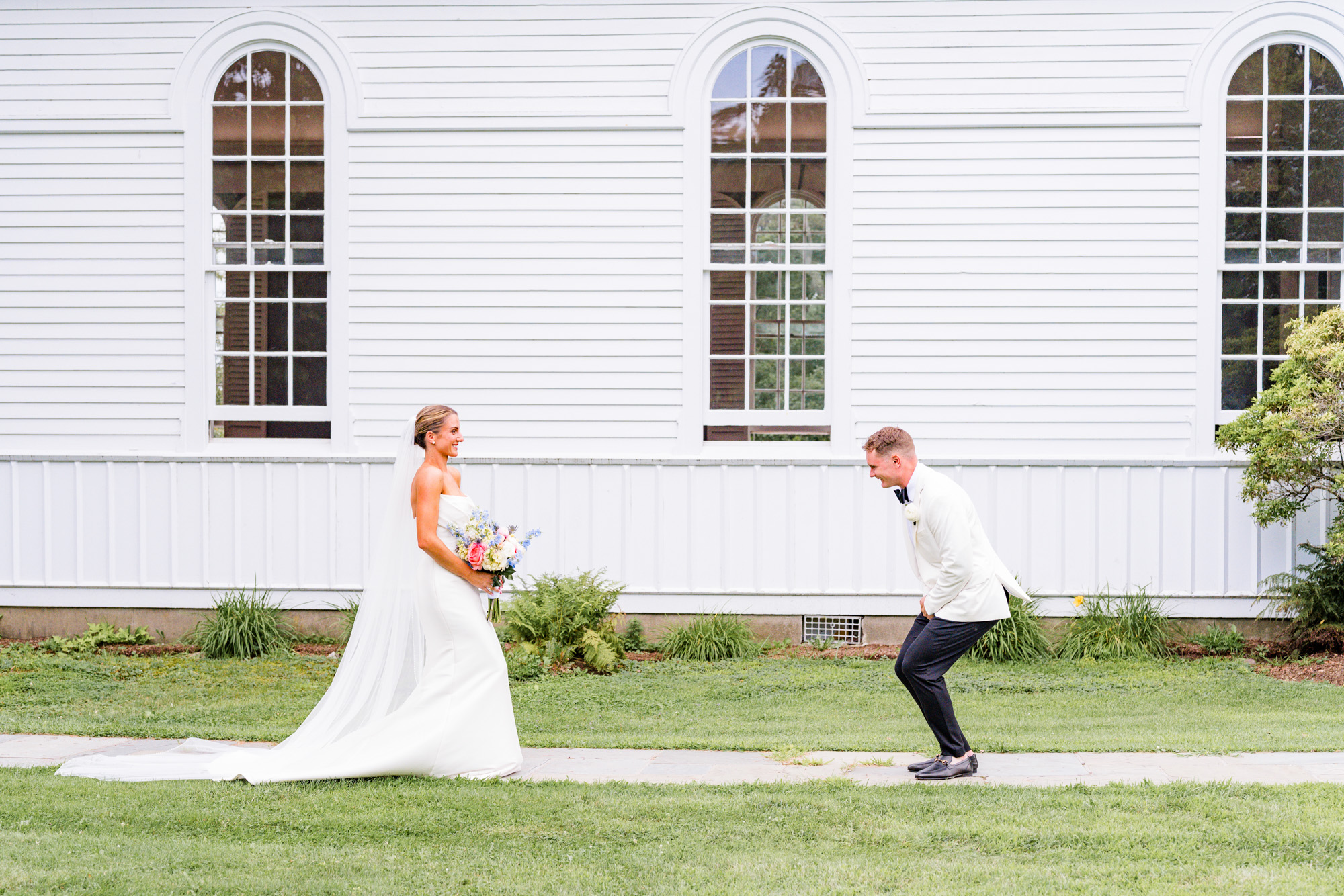 Groom reacting joyfully during his first look with the bride in Pawling New York