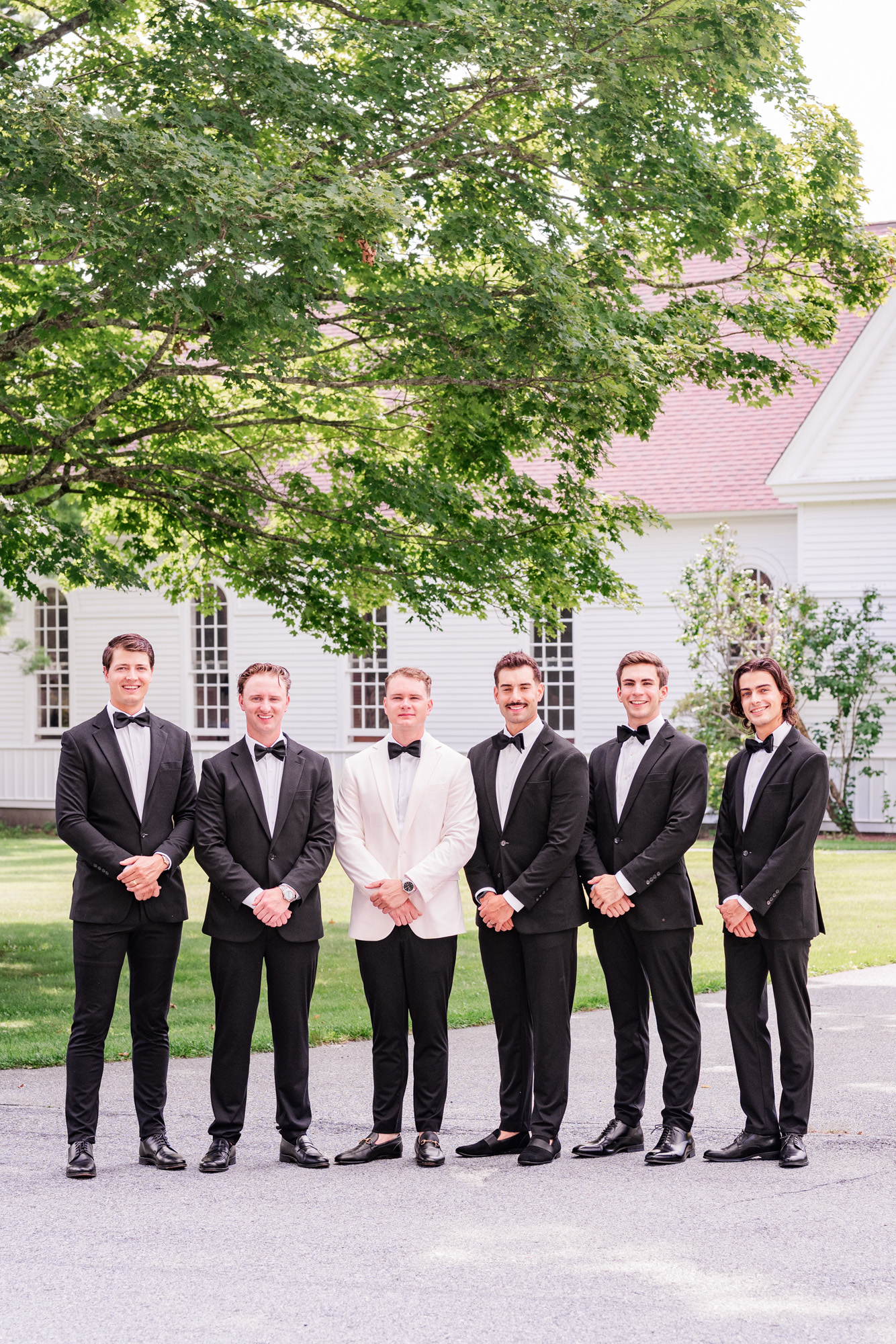 Groomsmen formal in front of Christ church on Quaker Hill