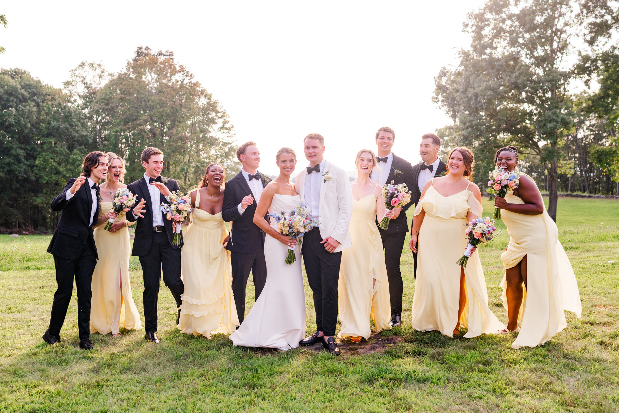 wedding party all laughing and running