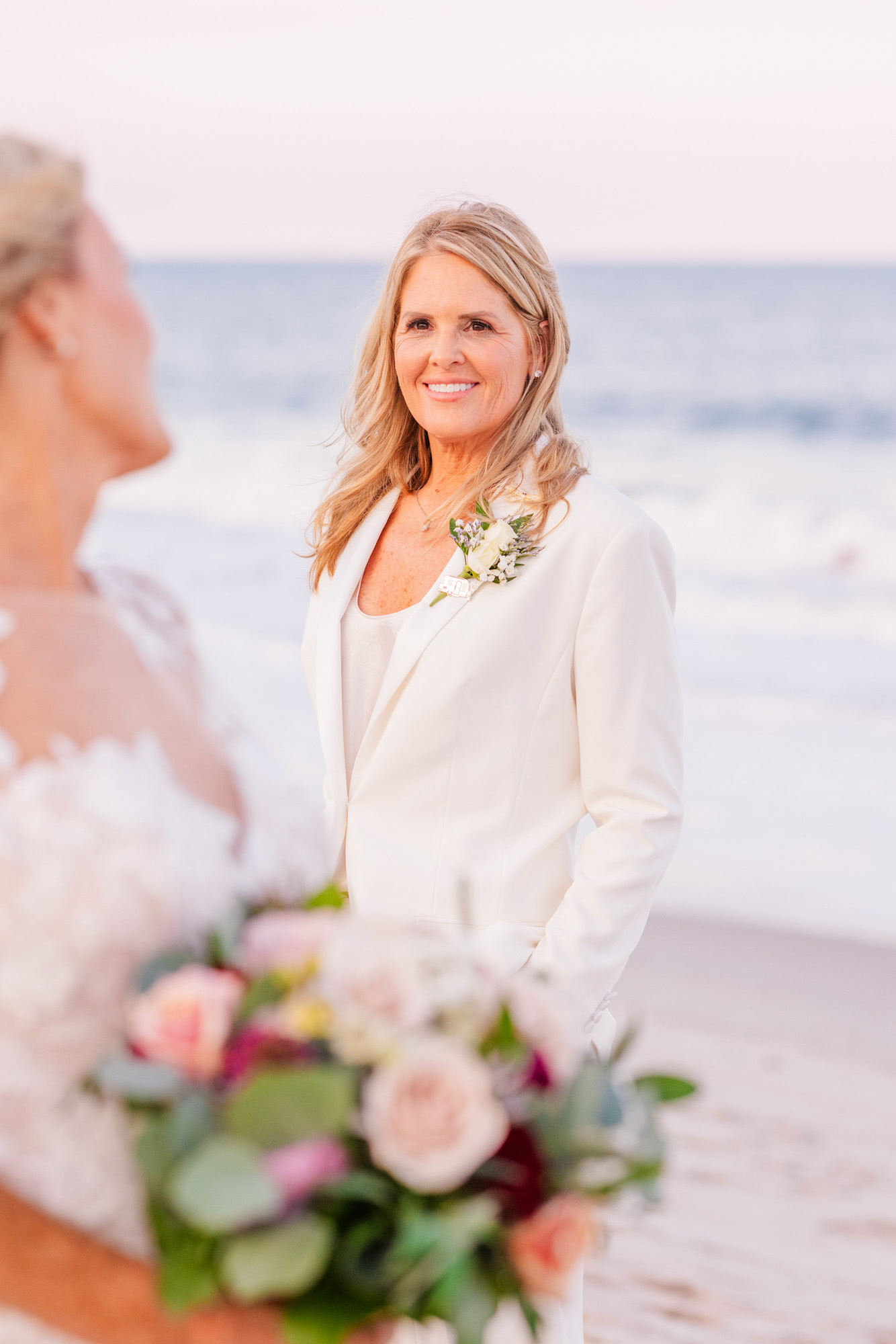 d her partner during beach portraits.