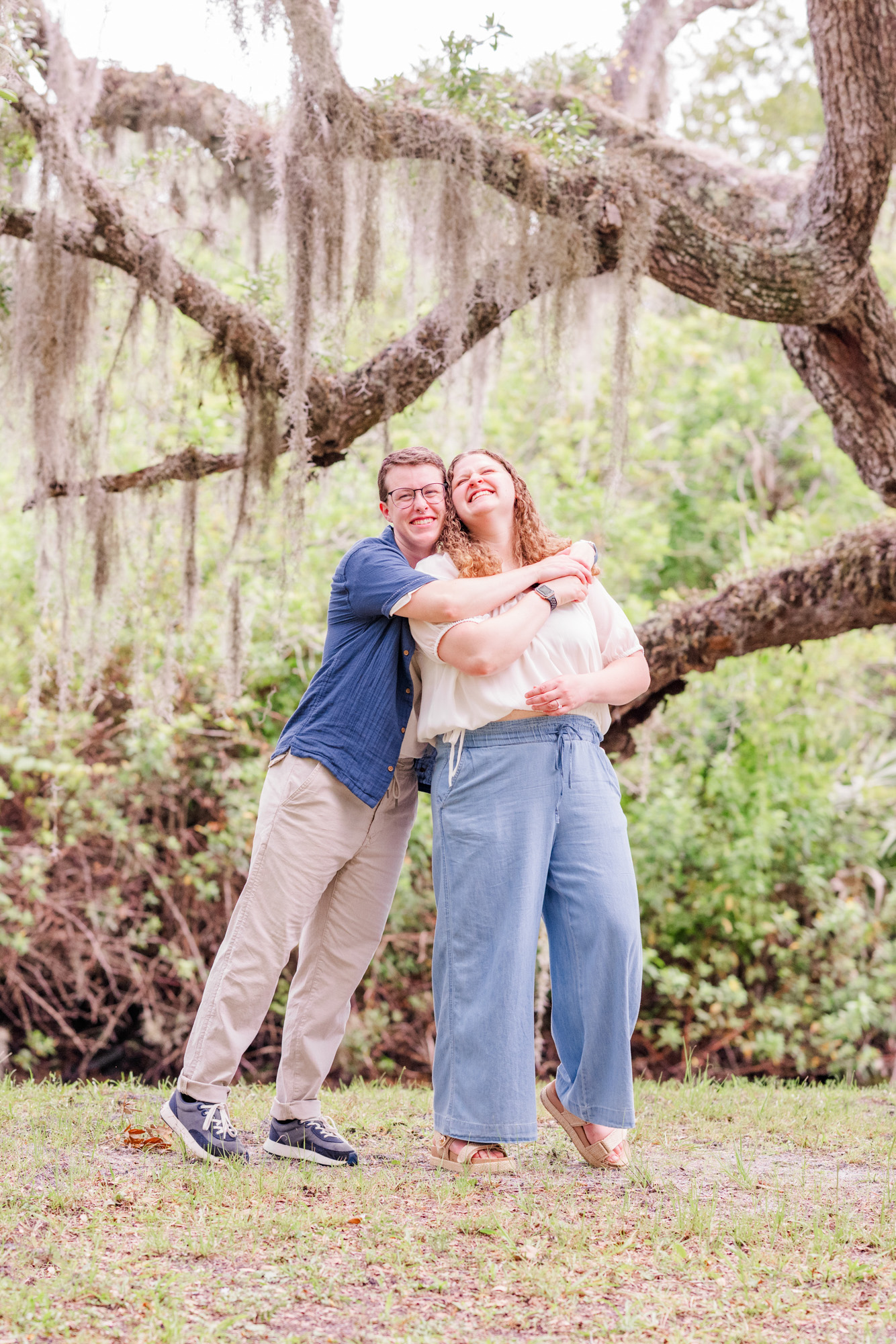 couple hugging my the creek at Up the Creek Farms