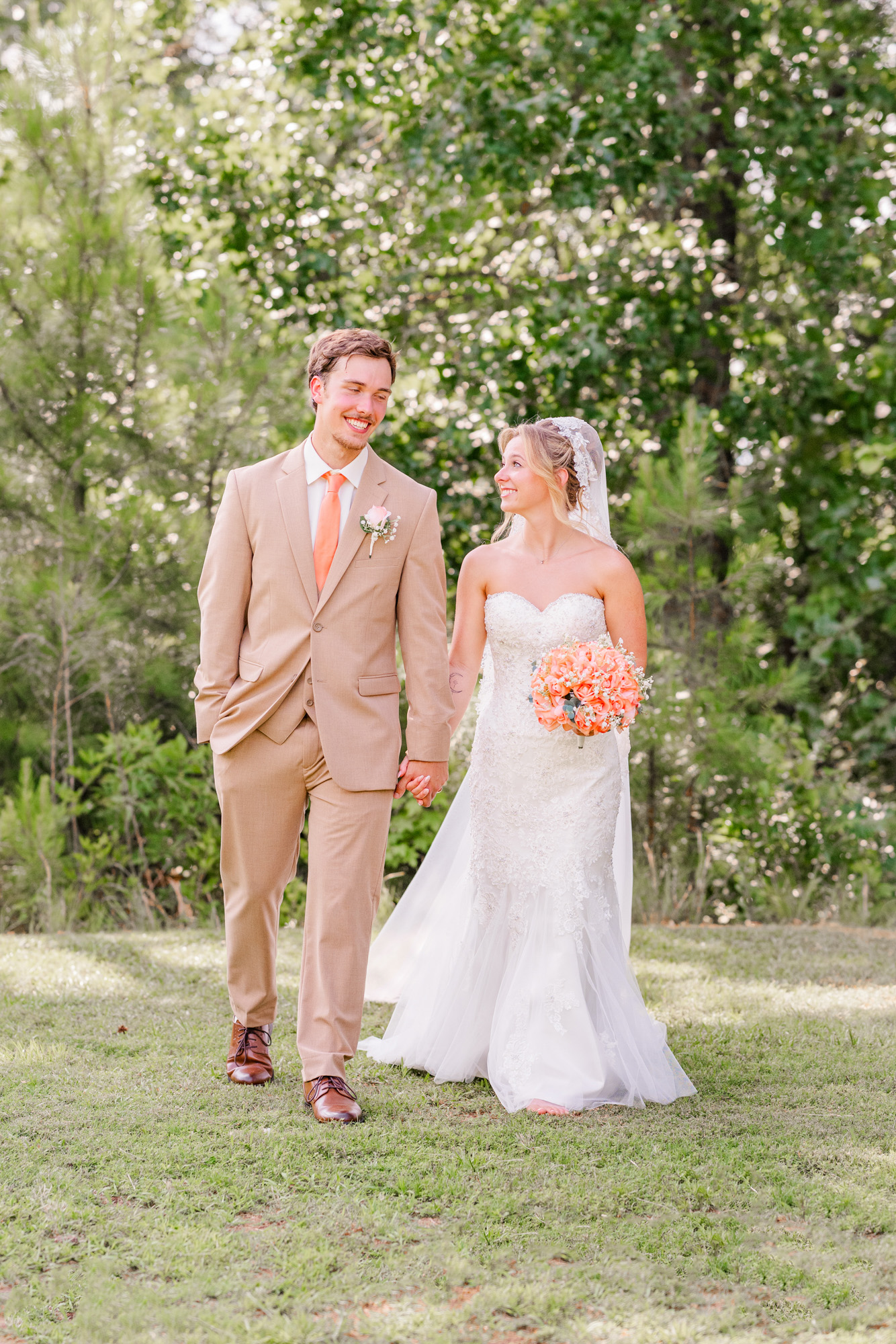 Bride and groom walking hand in hand together after their wedding portraits.