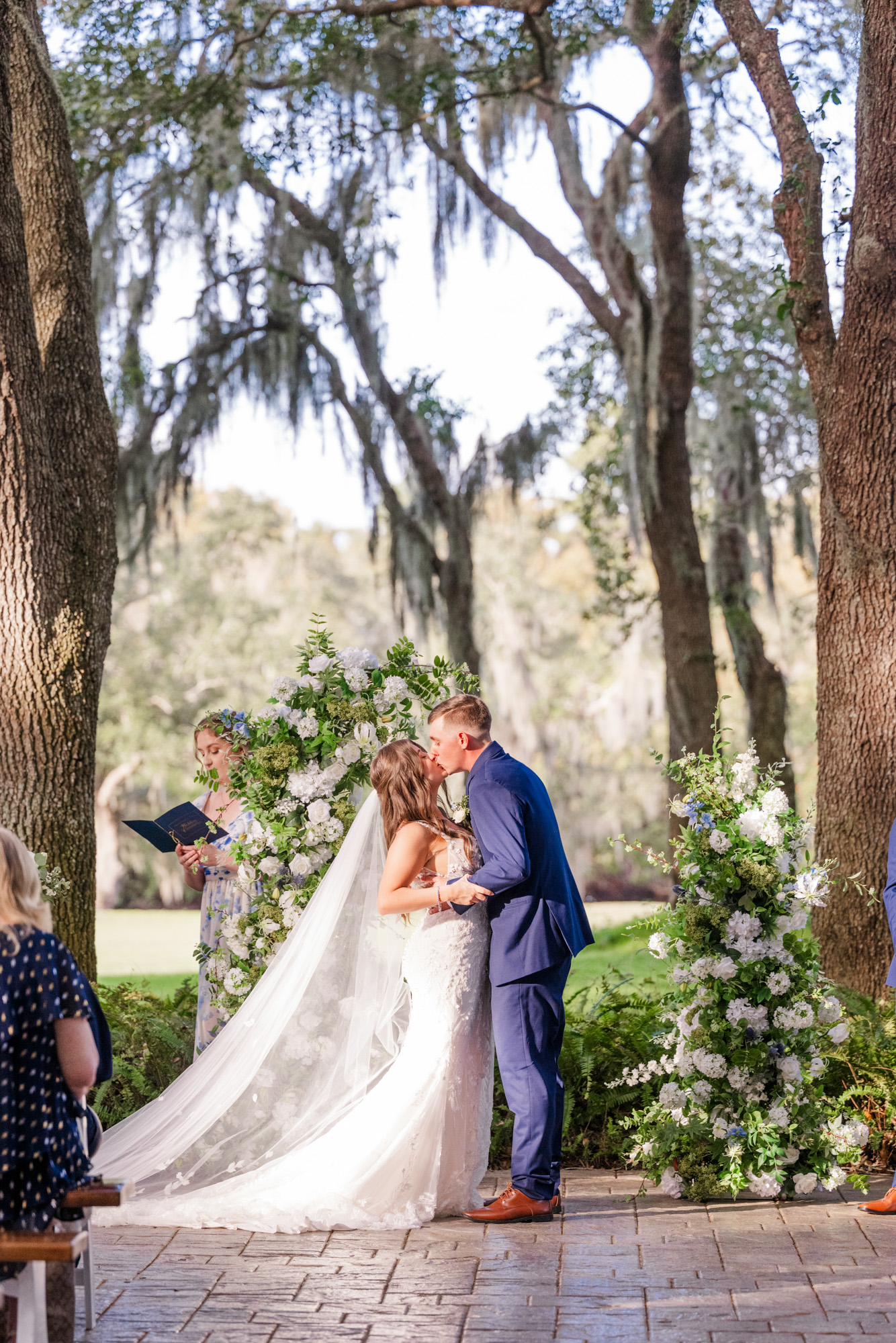Couple sharing first kiss after their ceremony at Up the Creek Farms
