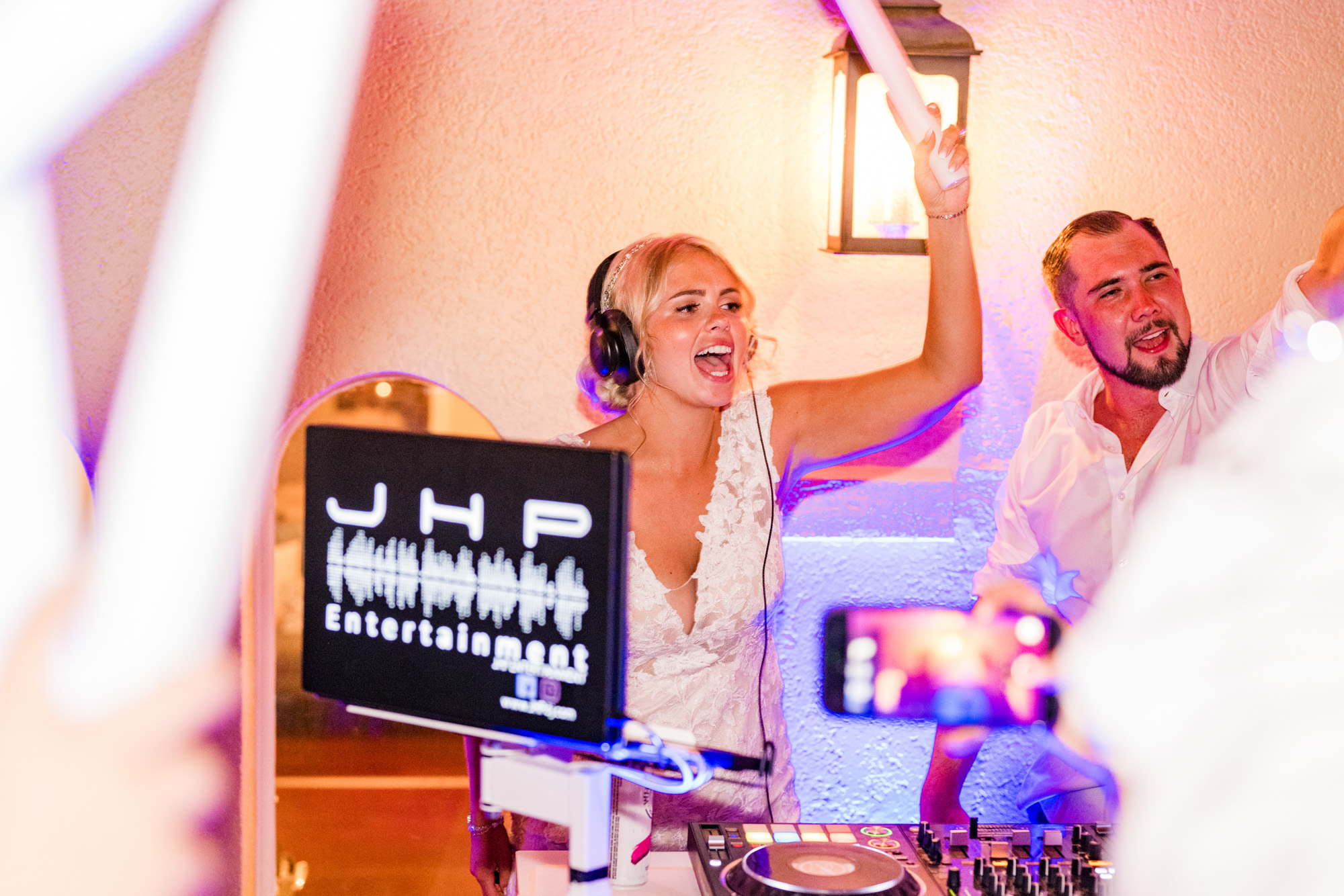 bride at the White Room wedding behind the DJ booth