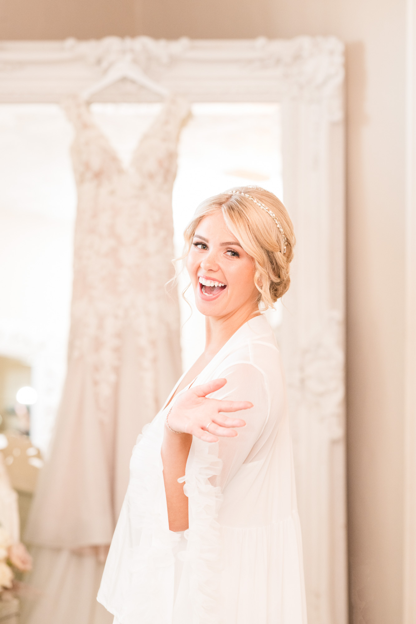 Bride getting excited about putting on her dress at The White Room in St. Augustine, Florida