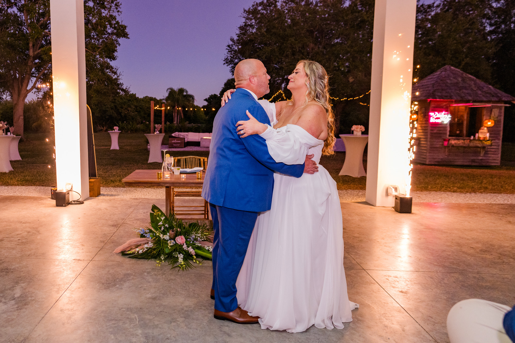 Bride and groom dancing at their open-air wedding reception at The Treehouse in Vero Beach.
