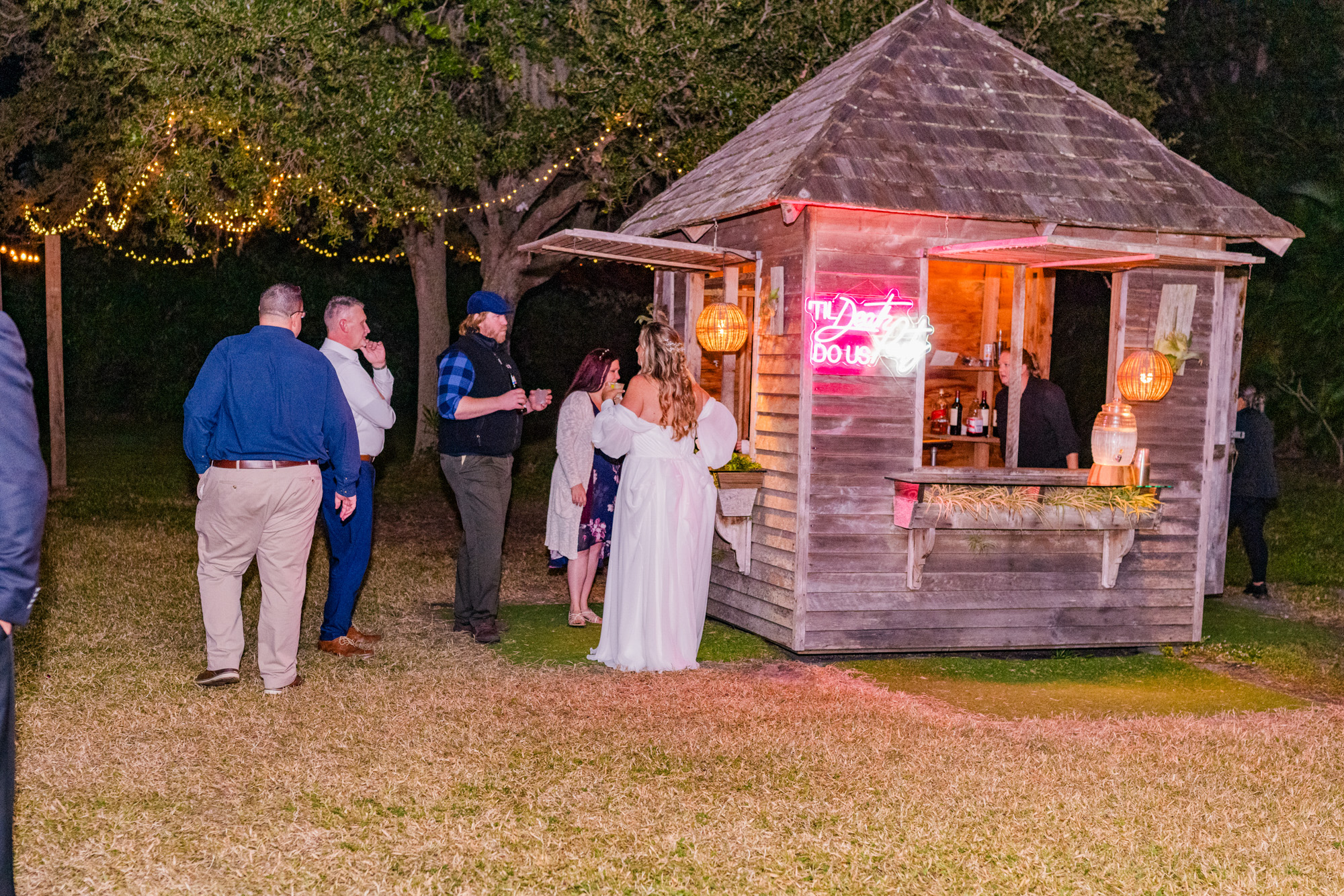 Outdoor wedding bar with string lights at The Treehouse in Vero Beach, Florida.