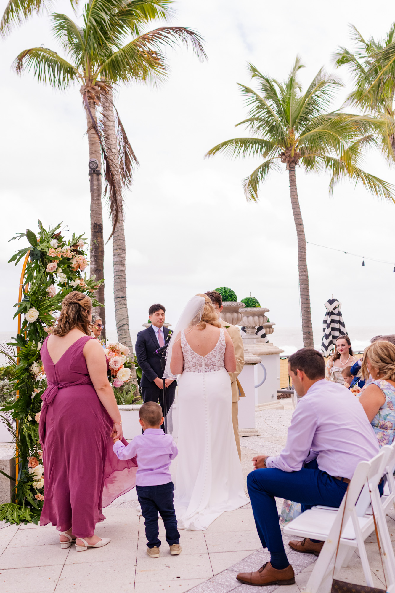 Bride and groom exchanging vows at an oceanfront wedding ceremony at Vero Beach Hotel & Spa.