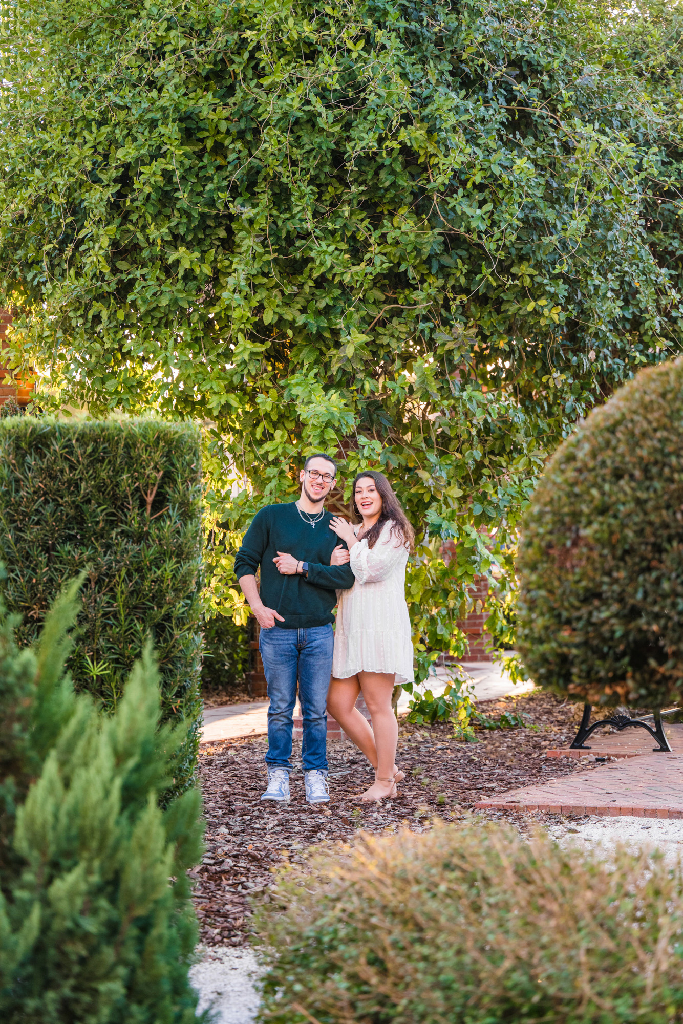 couple holding their dog during their Winter Park engagement session