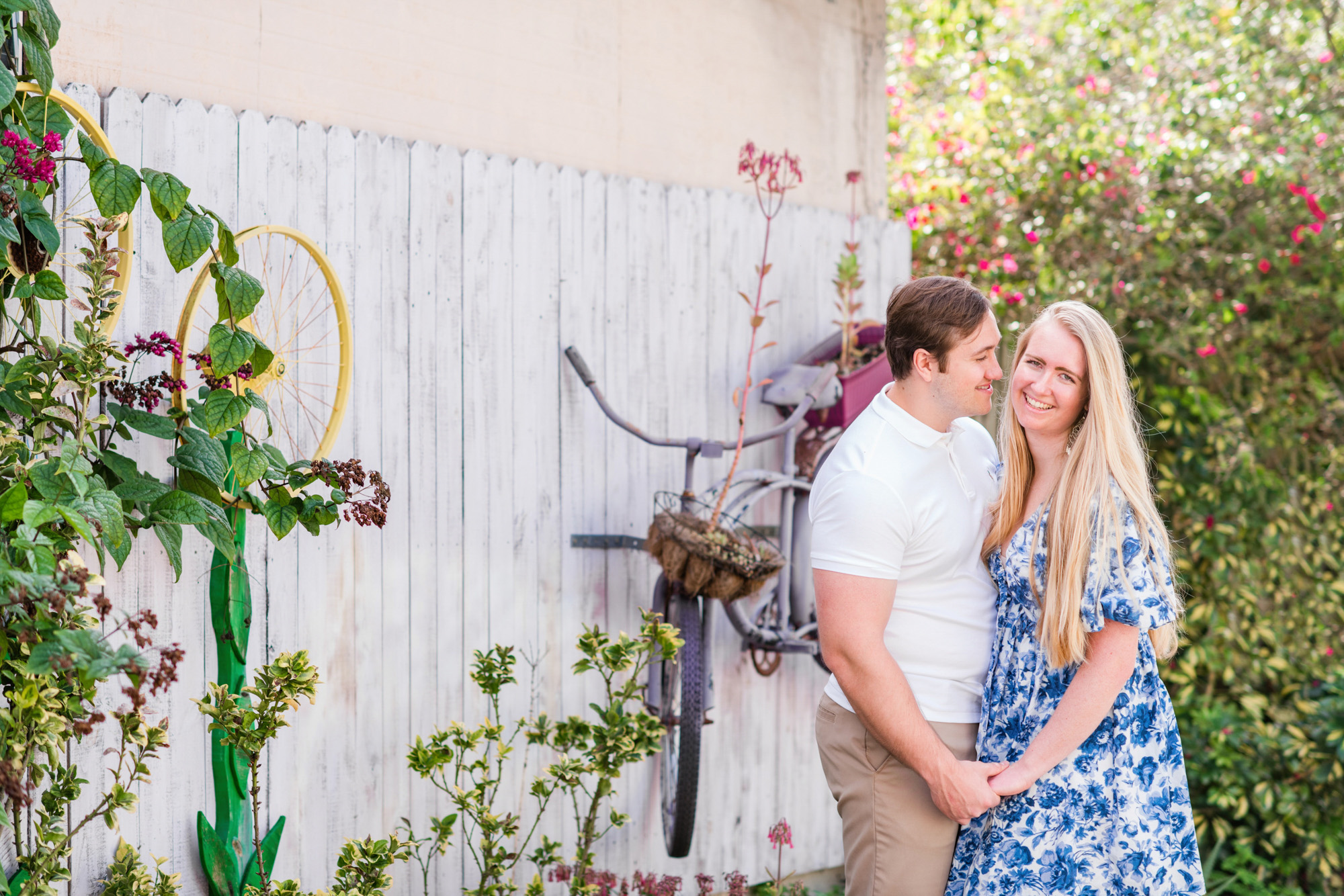 couple holding hands in back alley of Eau Gallie arts district