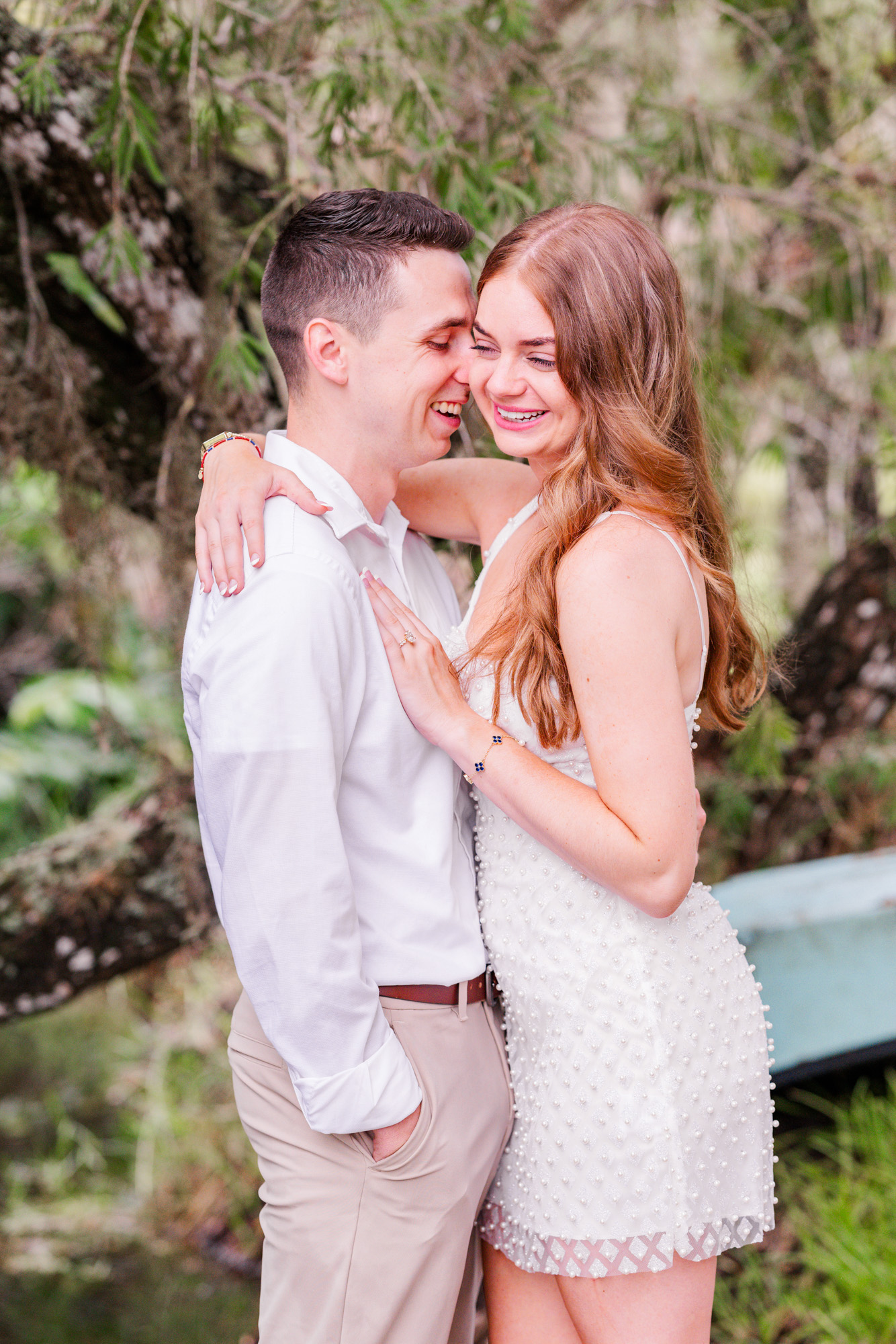 Woman looking at engagement ring during their Up the Creek Farms engagement session