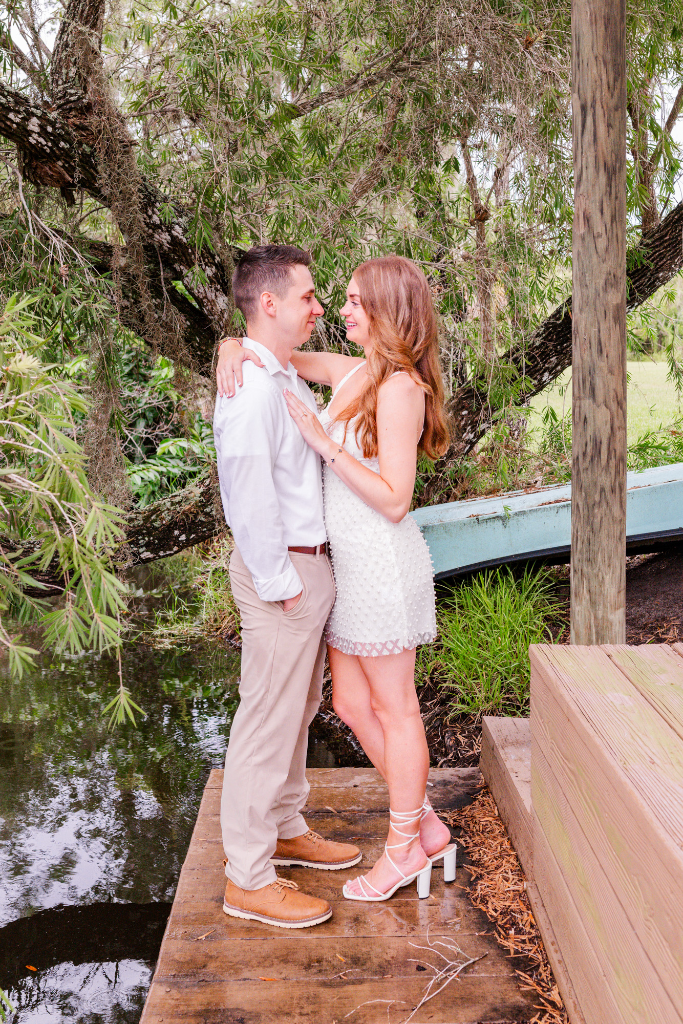 Man and woman hugging by the river at Up the Creek Farms