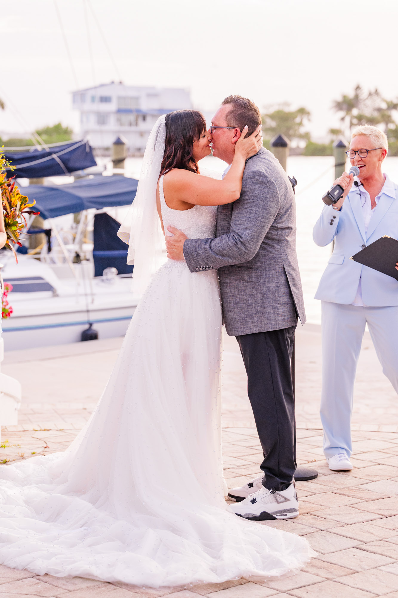 Bride and groom sharing their first kiss at the Eau Gallie Yacht Club in Indian Harbour Beach, Florida